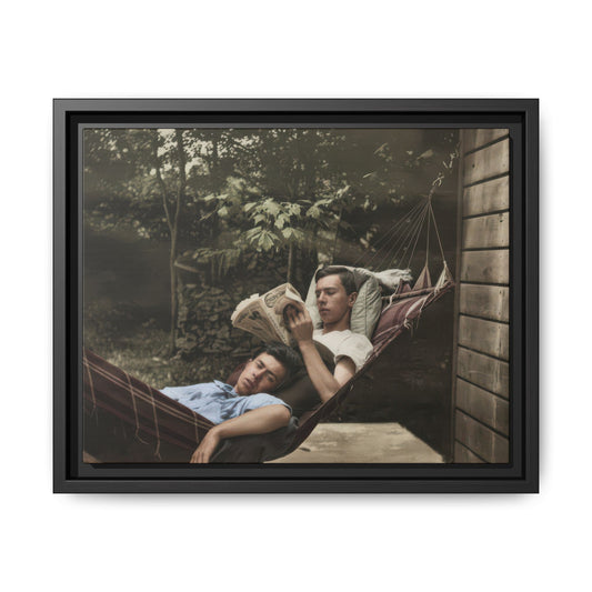 Vintage double portrait of two men resting together in a striped hammock outdoors beside a wooden wall