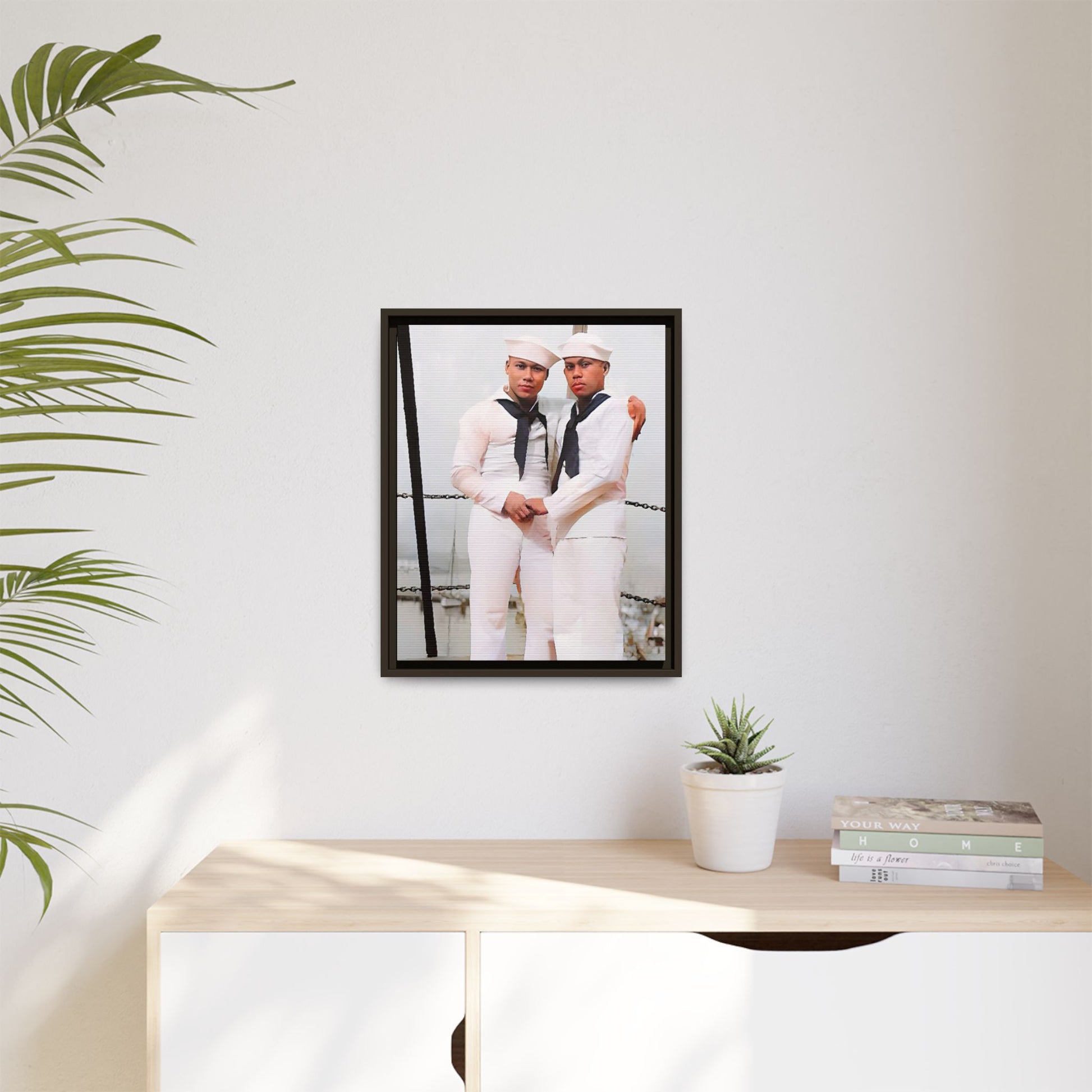 A restored vintage photograph of two Navy sailors standing together aboard a naval ship at Apra Harbor, Guam. Dressed in crisp white uniforms, their hands gently clasped, the image captures a quiet moment of strength, devotion, and LGBTQ+ military history.