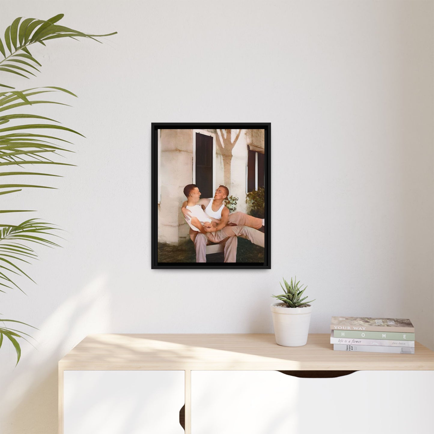 A vintage photograph of Donald and Joseph, two men embracing with joy in 1930s New Orleans. Captured in warm sunlight against a rustic Louisiana home, this intimate portrait celebrates LGBTQ+ history, love, and the beauty of unspoken connection. Gay Couple