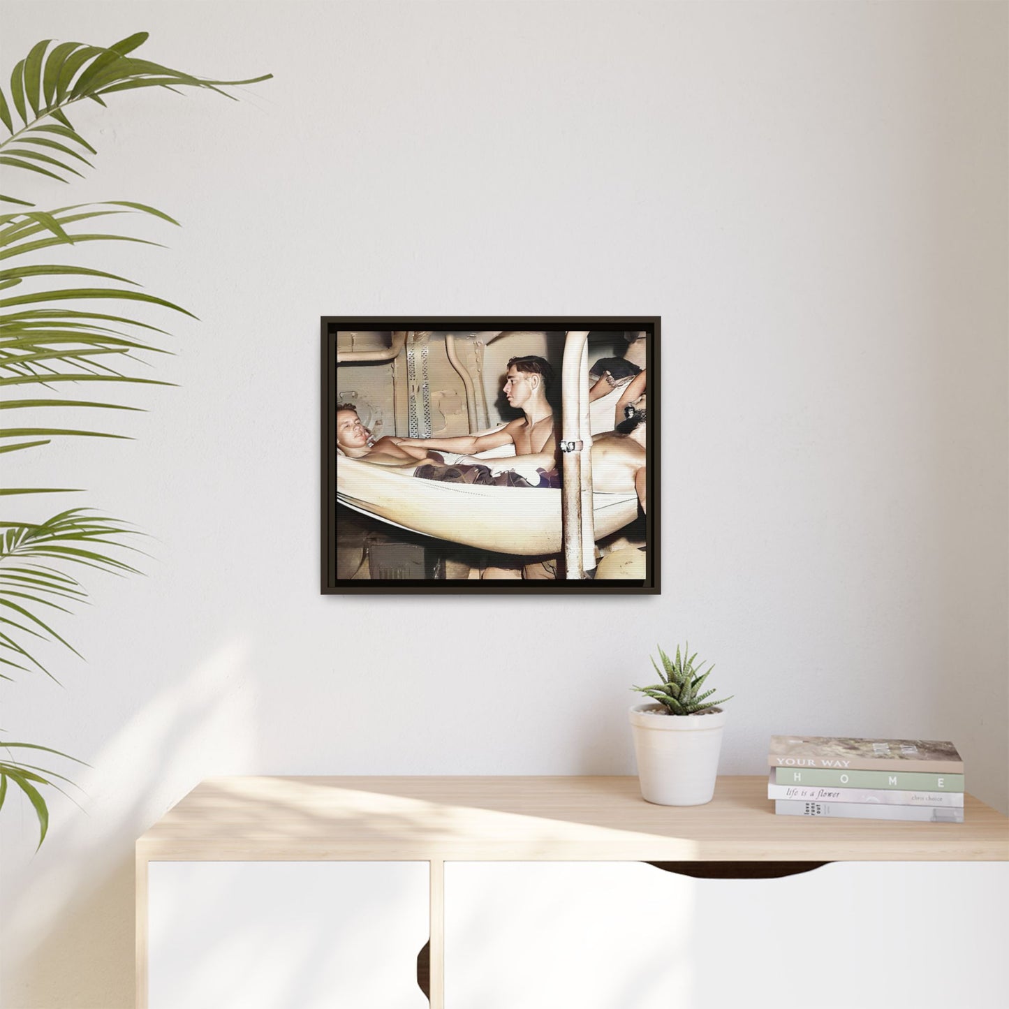 A framed vintage maritime photo on matte canvas featuring sailors aboard the Orleans, capturing life at sea and camaraderie.
