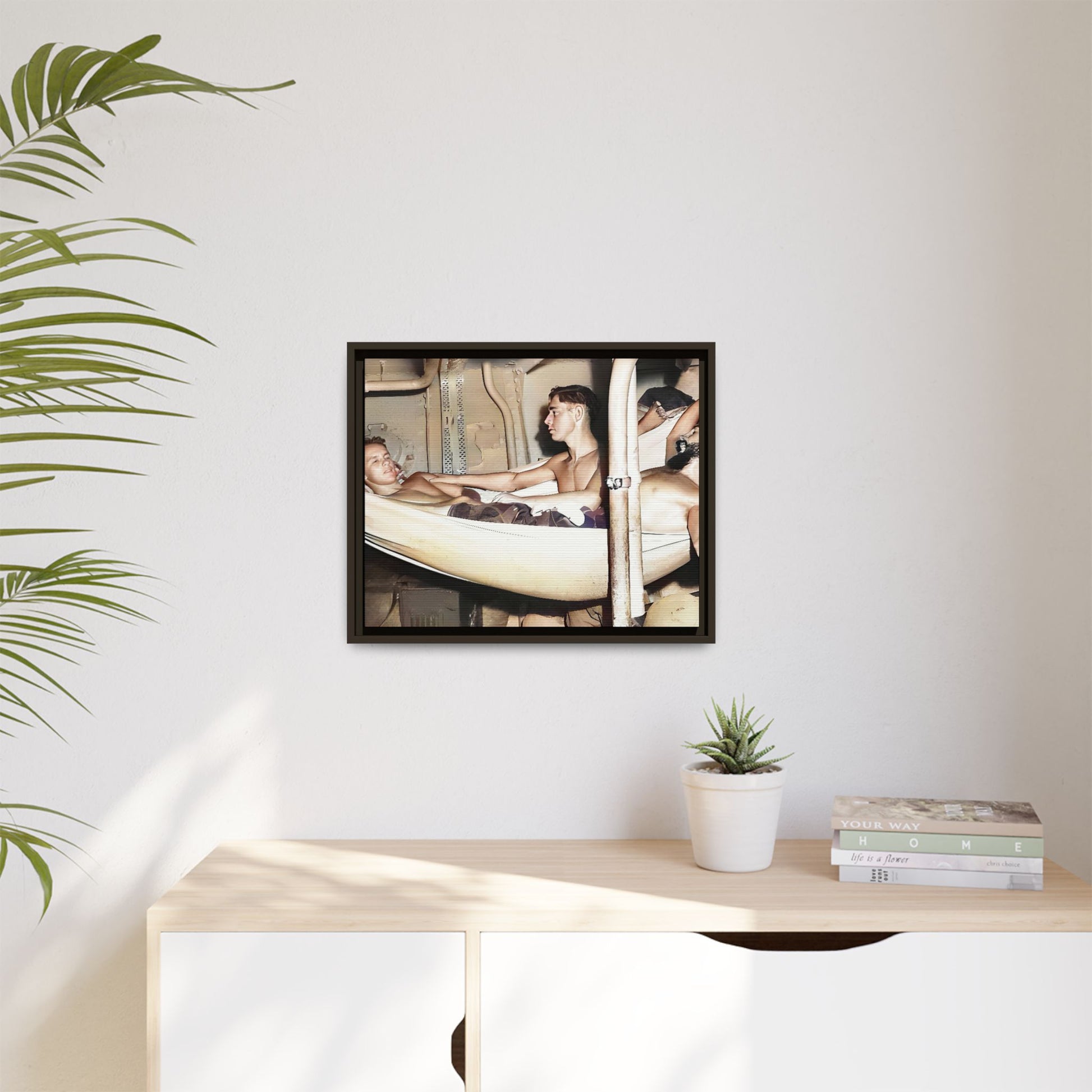 A framed vintage maritime photo on matte canvas featuring sailors aboard the Orleans, capturing life at sea and camaraderie.