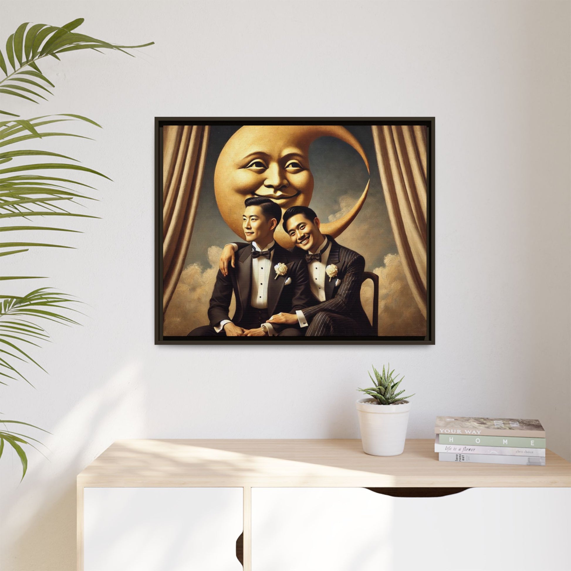 Vintage-inspired artwork of a romantic gay Asian couple in tuxedos sitting affectionately beneath a smiling crescent moon prop, surrounded by vintage stage curtains and dreamy clouds. A reclaimed queer narrative from the Man In The Moon series.