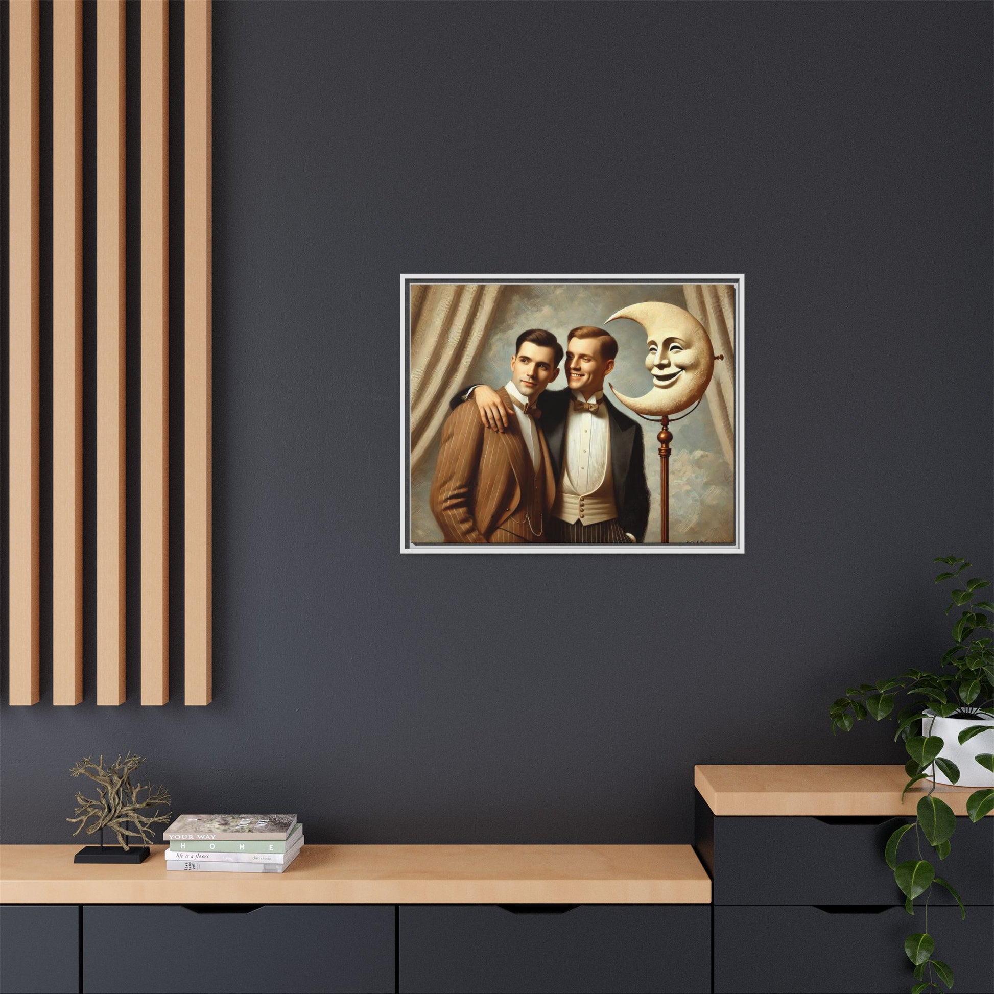 Framed matte canvas artwork of two men in vintage tuxedos standing beside a crescent moon prop. This piece reclaims LGBTQ+ representation lost to bias and honors everyday moments of affection and connection once absent from historical archives.
