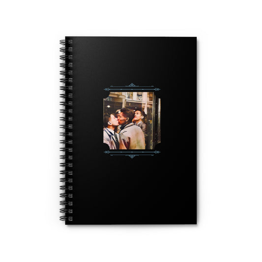Black spiral notebook featuring a restored color photo of two young Black men kissing on a city street