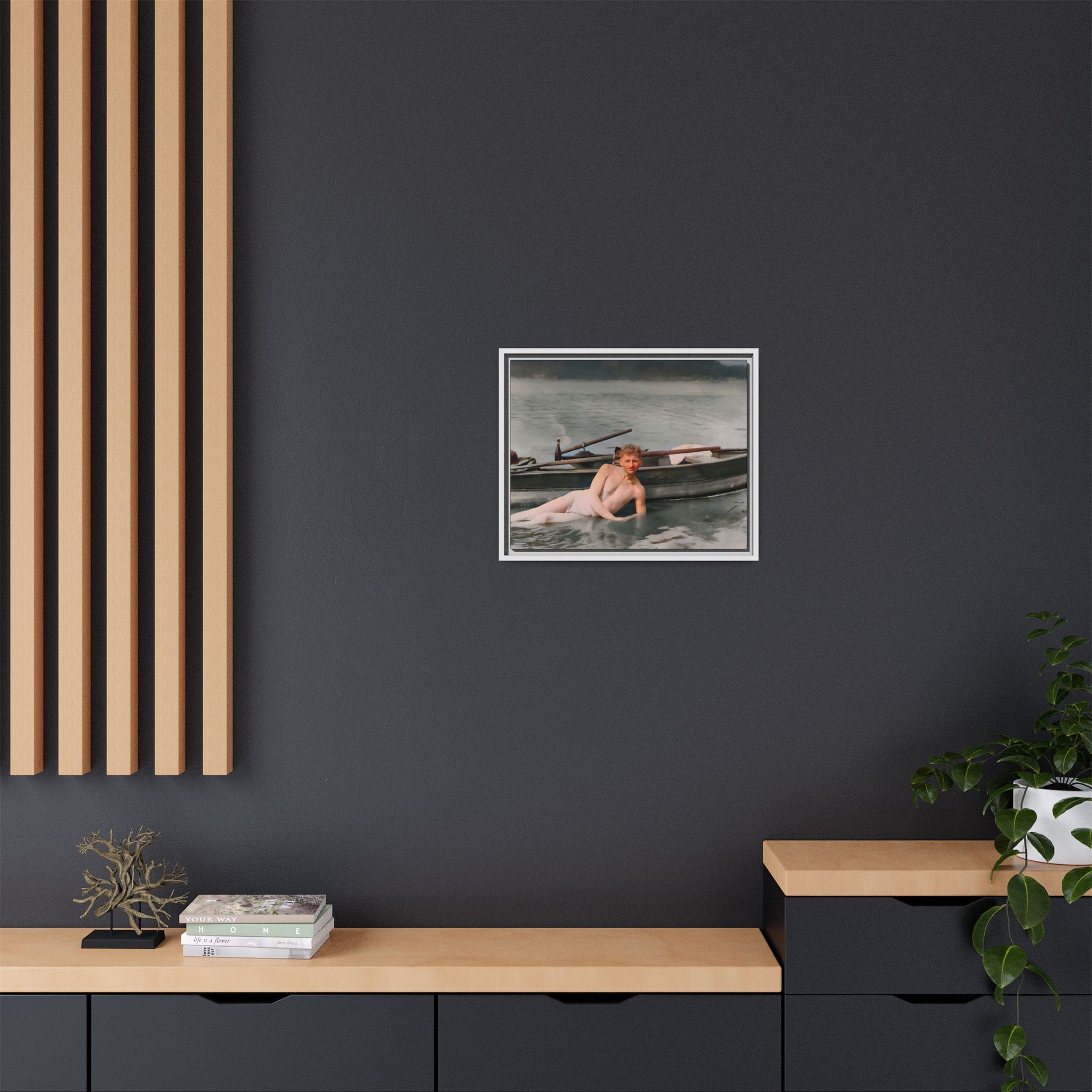 Restored vintage photo of Claude reclining by a rowboat on a calm lake in early 1900s Green Bay, Wisconsin. Framed matte canvas art celebrating serenity, history, and individuality.