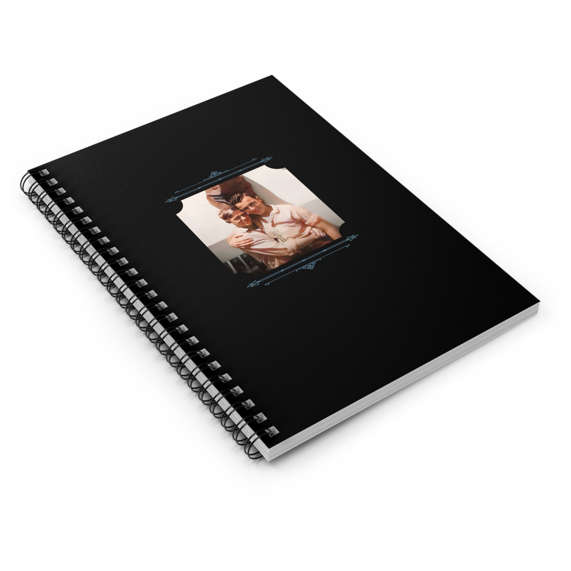 Black spiral notebook cover with a joyful vintage photo of a young gay couple hugging in mid-century attire