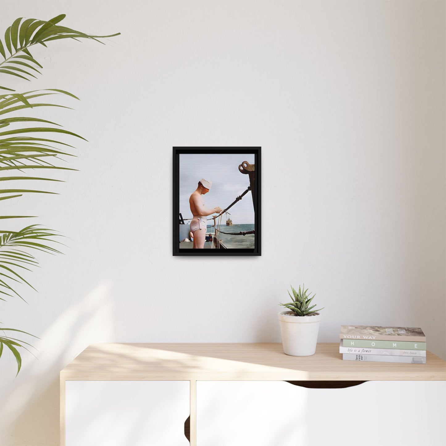 A framed vintage naval portrait on matte canvas featuring a sailor aboard the USS Iowa, honoring maritime history and dedication.