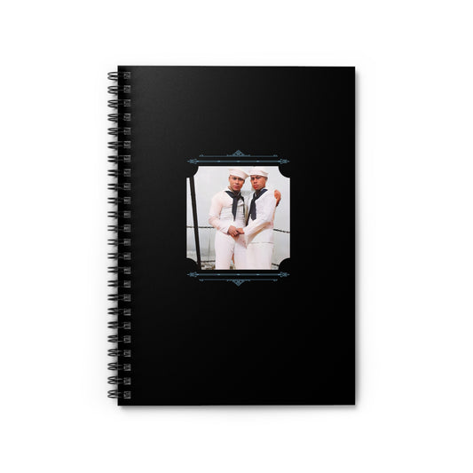 Black spiral notebook with a restored WWII-era photo of two Puerto Rican sailors holding each other on a Navy ship