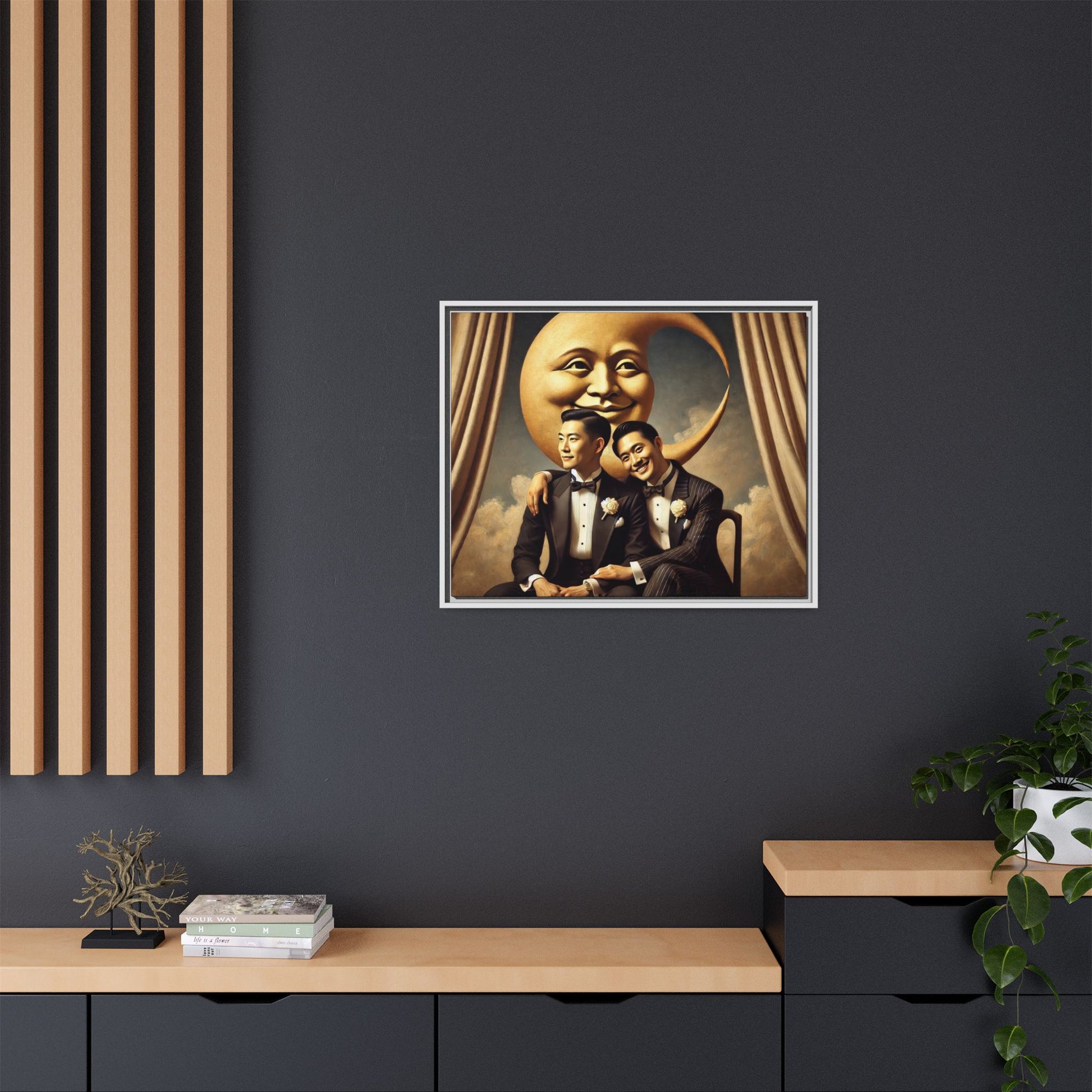 Vintage-inspired artwork of a romantic gay Asian couple in tuxedos sitting affectionately beneath a smiling crescent moon prop, surrounded by vintage stage curtains and dreamy clouds. A reclaimed queer narrative from the Man In The Moon series.