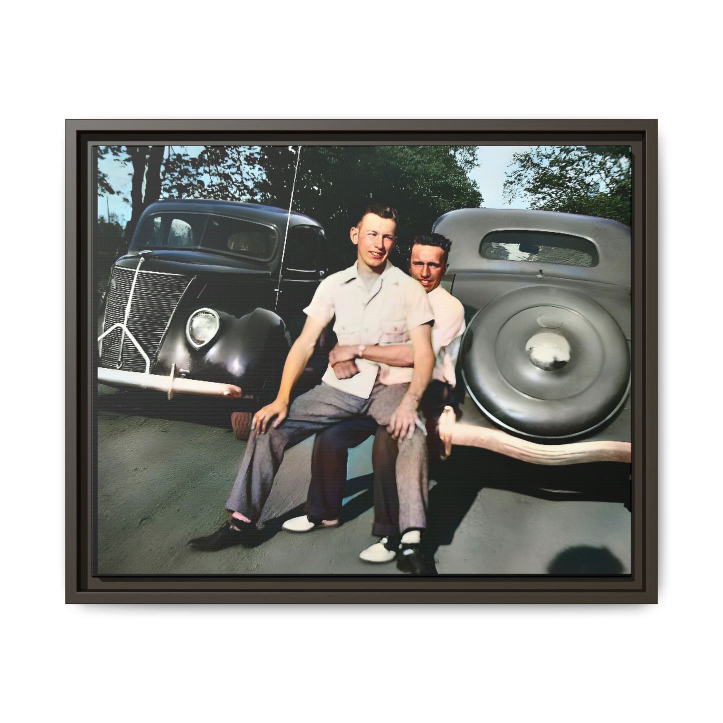 Restored vintage photograph of Andrew and Eugene seated on a classic car bumper in 1930s Lincoln, Nebraska. Framed matte canvas print celebrating LGBTQ+ history, love, and timeless companionship. Gay Couple