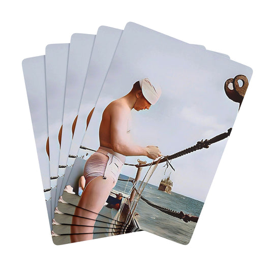 Vintage photo of a shirtless sailor on a naval ship, adjusting rigging with the ocean in the background, symbolizing maritime life.