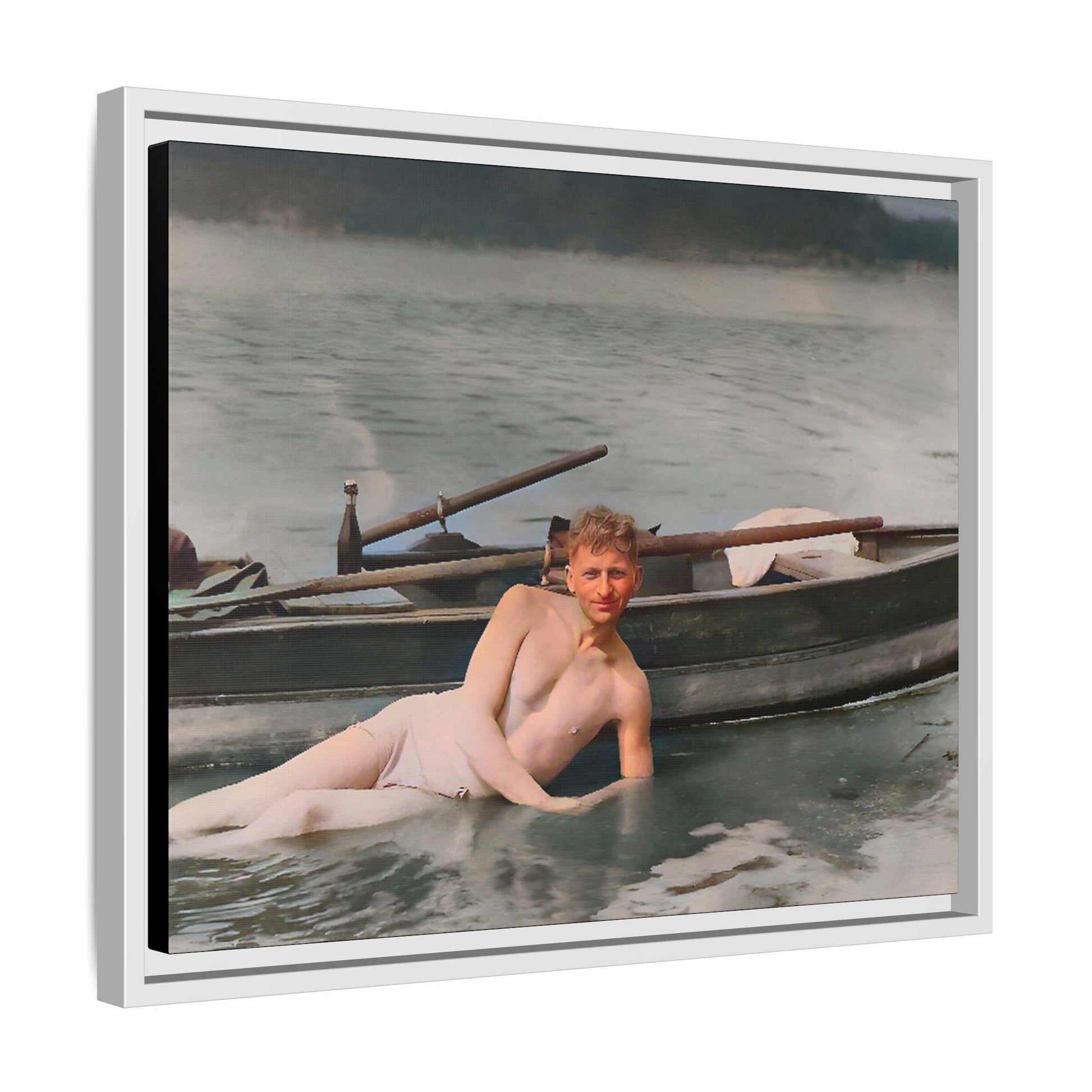 Restored vintage photo of Claude reclining by a rowboat on a calm lake in early 1900s Green Bay, Wisconsin. Framed matte canvas art celebrating serenity, history, and individuality.