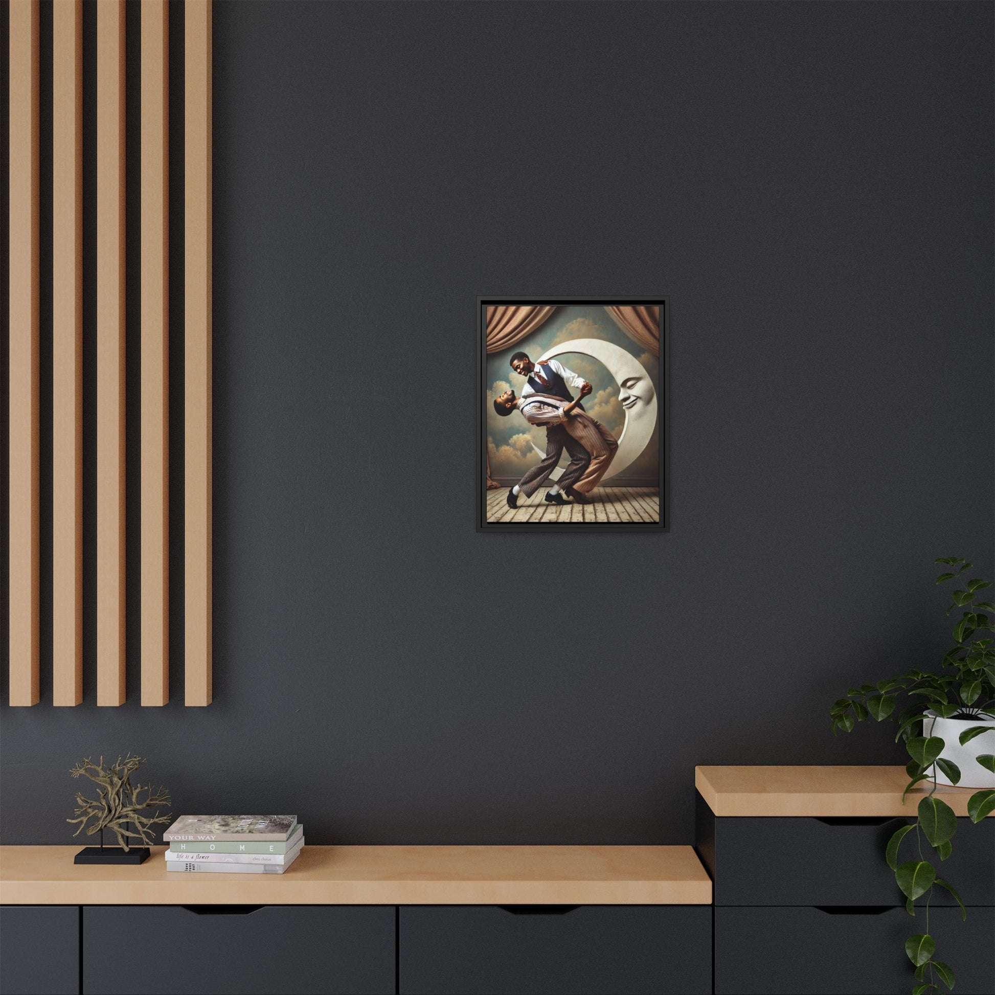 Framed artwork of two Black men in vintage suits dancing tenderly beneath a crescent moon with a smiling face. A romantic 1920s-inspired scene with velvet curtains and a painted sky backdrop. Part of a collection reclaiming lost queer Black history and art.