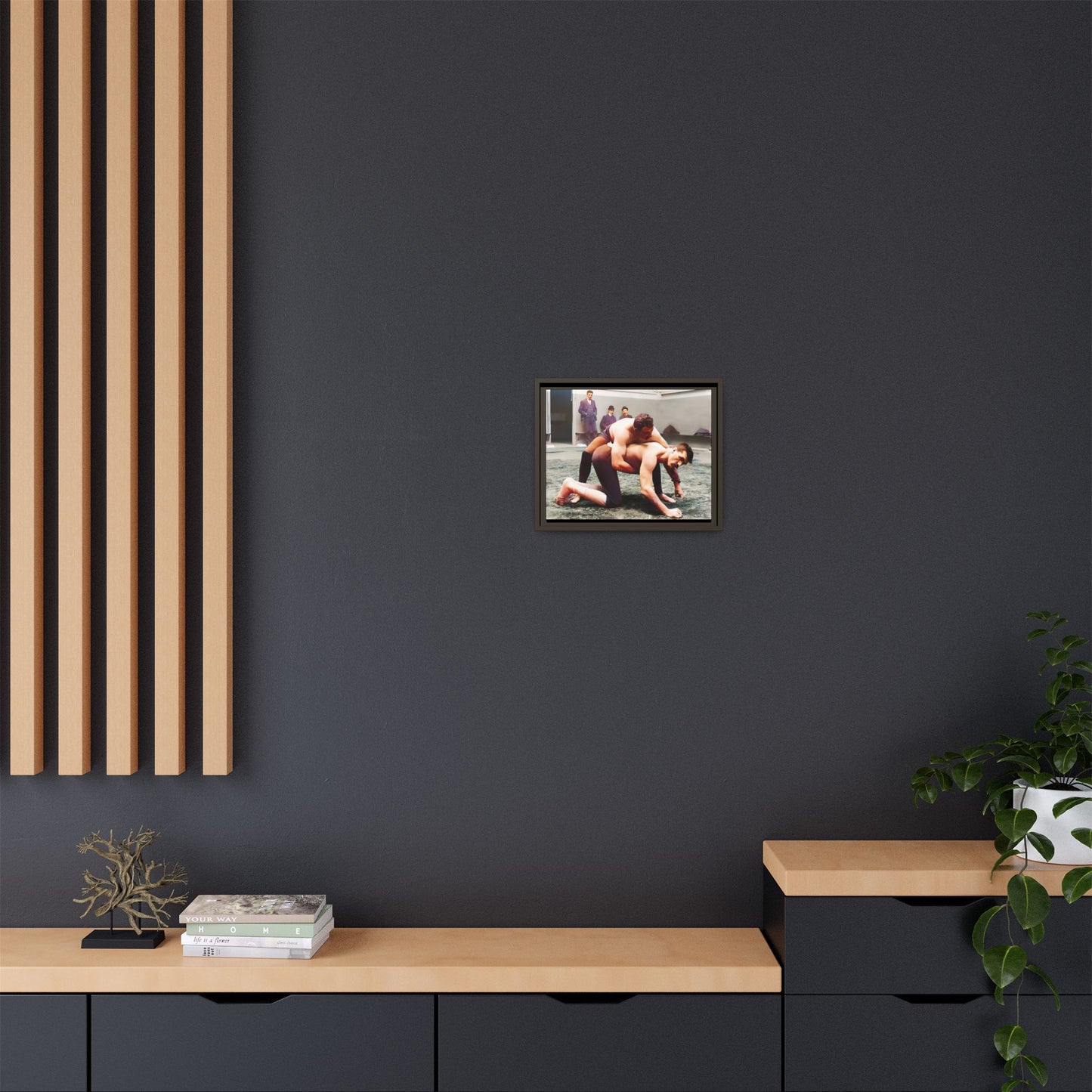 A framed vintage wrestling photograph on matte canvas featuring a Victorian-era match at Love’s Wrestling Club in Plumstead, UK, capturing strength and camaraderie.