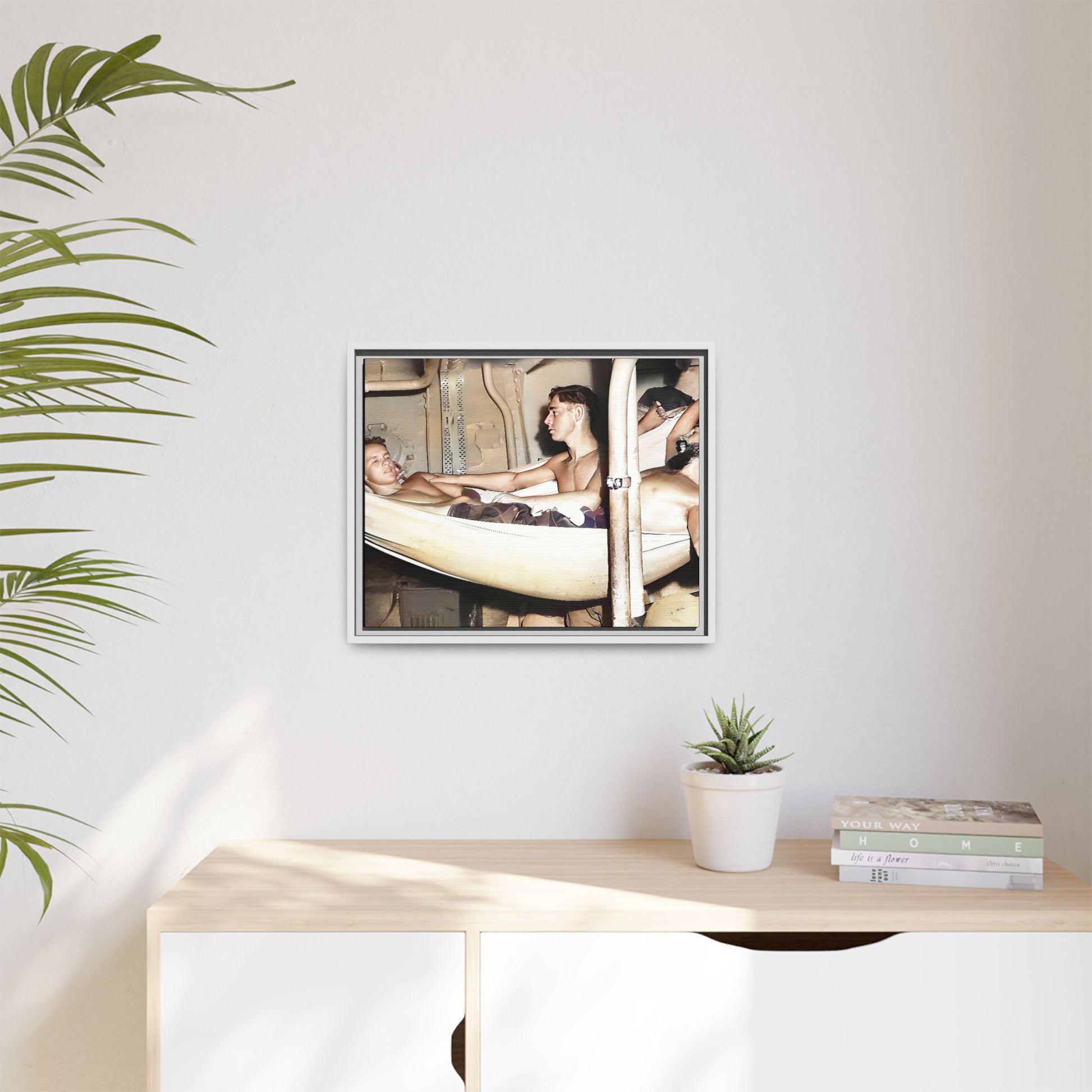 A framed vintage maritime photo on matte canvas featuring sailors aboard the Orleans, capturing life at sea and camaraderie.
