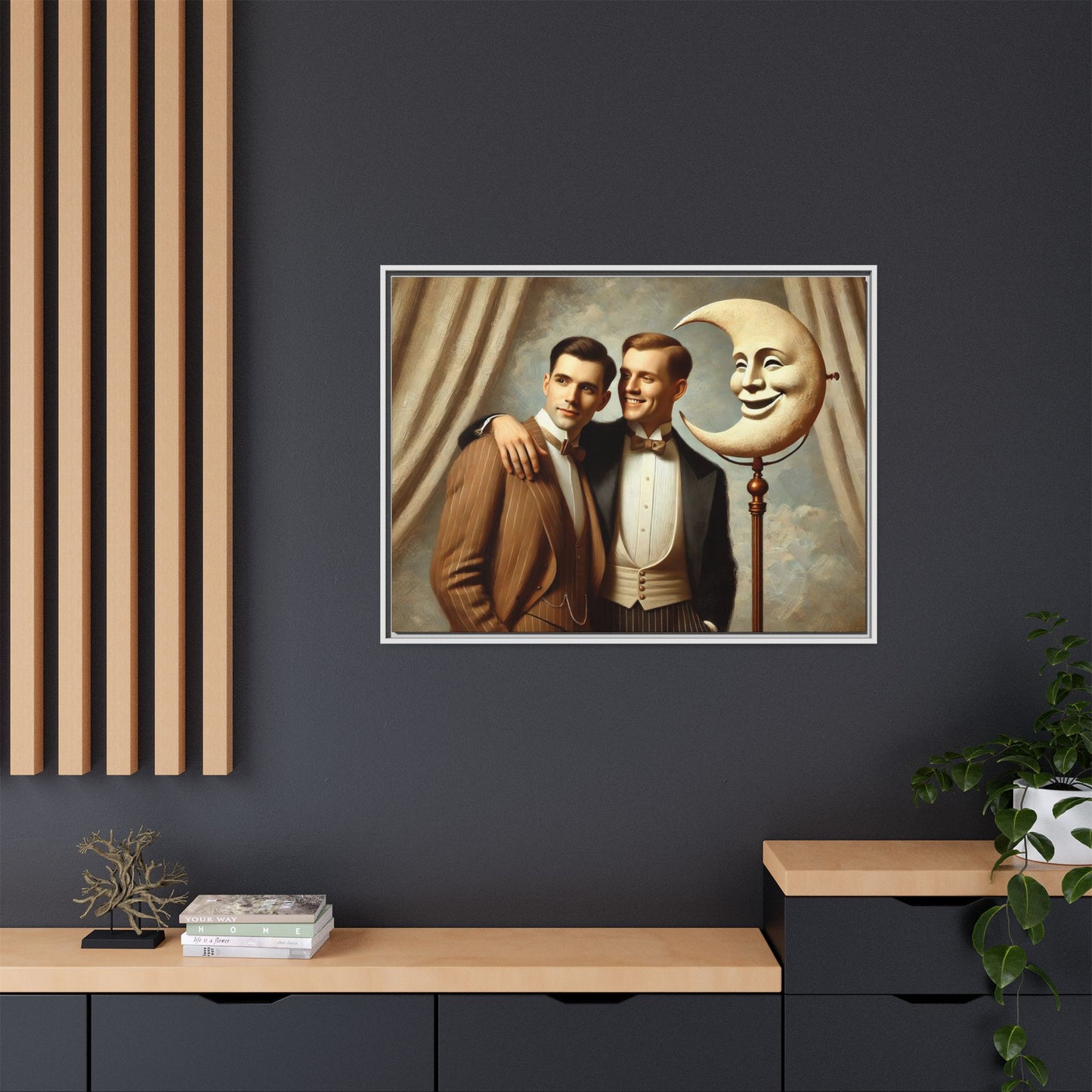 Framed matte canvas artwork of two men in vintage tuxedos standing beside a crescent moon prop. This piece reclaims LGBTQ+ representation lost to bias and honors everyday moments of affection and connection once absent from historical archives.