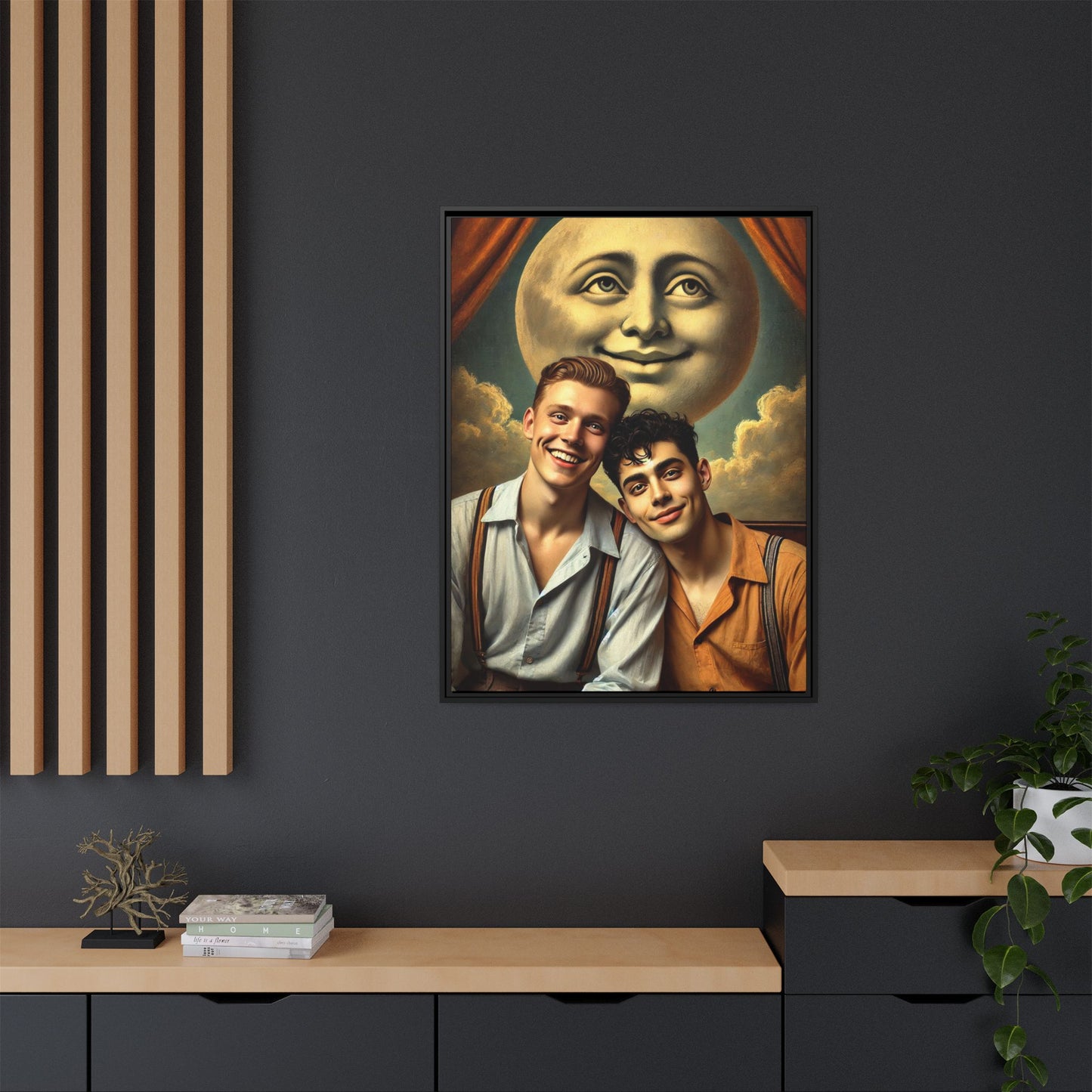 Framed artwork featuring a joyful queer couple in 1930s attire, seated close together beneath a smiling full moon in a theatrical studio setting. A celebration of reclaimed LGBTQ+ narratives in nostalgic portraiture.
