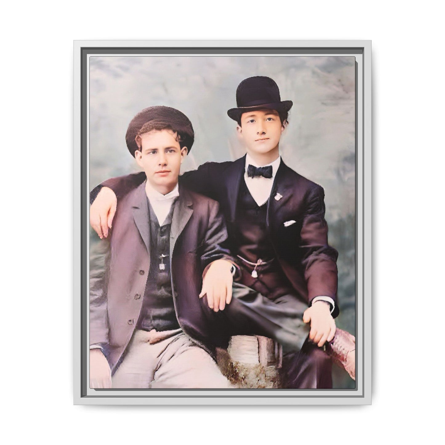 A stunningly restored early 20th-century portrait of Francis and Fai in Santa Barbara, California. Dressed in elegant bowler hats and classic suits, the two men share a poised yet deeply connected moment. The soft pastel tones and refined attire highlight a timeless love story, celebrating LGBTQ+ history and authentic companionship. Gay Couple