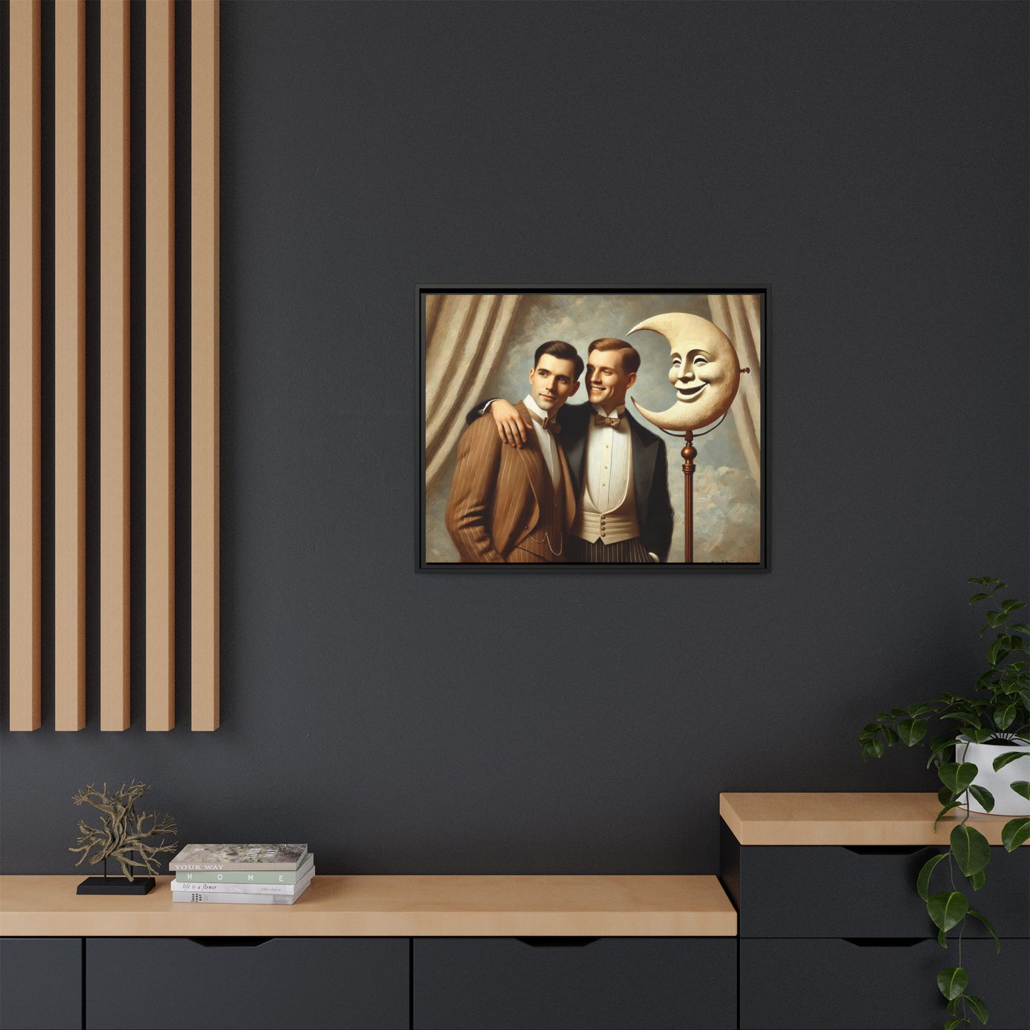 Framed matte canvas artwork of two men in vintage tuxedos standing beside a crescent moon prop. This piece reclaims LGBTQ+ representation lost to bias and honors everyday moments of affection and connection once absent from historical archives.