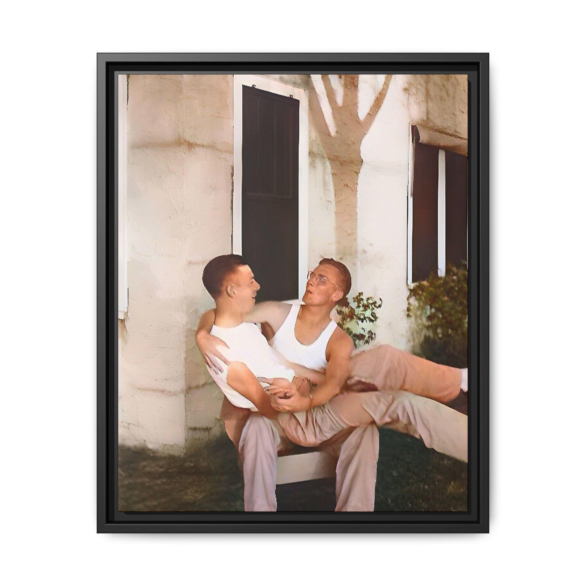 A vintage photograph of Donald and Joseph, two men embracing with joy in 1930s New Orleans. Captured in warm sunlight against a rustic Louisiana home, this intimate portrait celebrates LGBTQ+ history, love, and the beauty of unspoken connection. Gay Couple