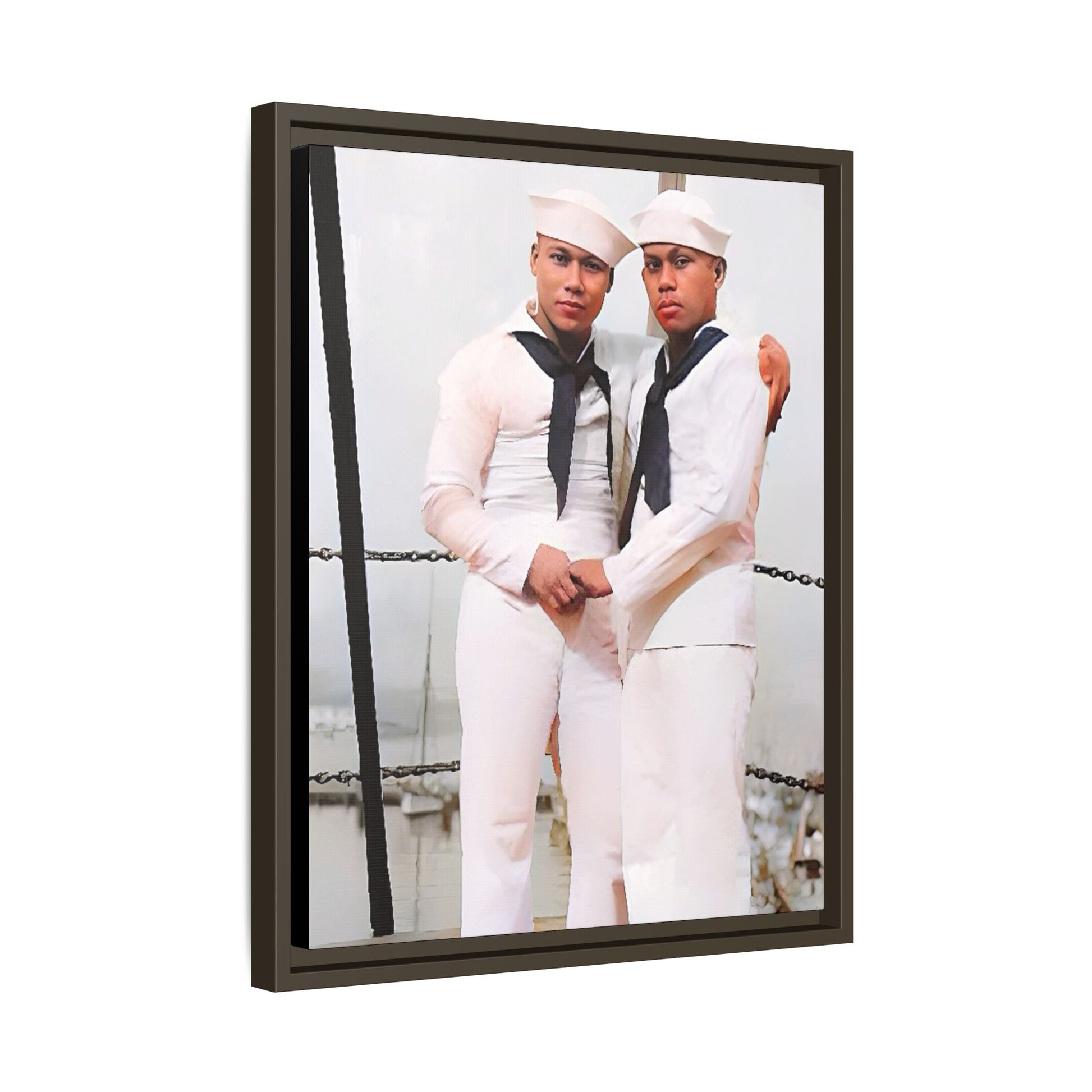 A restored vintage photograph of two Navy sailors standing together aboard a naval ship at Apra Harbor, Guam. Dressed in crisp white uniforms, their hands gently clasped, the image captures a quiet moment of strength, devotion, and LGBTQ+ military history.