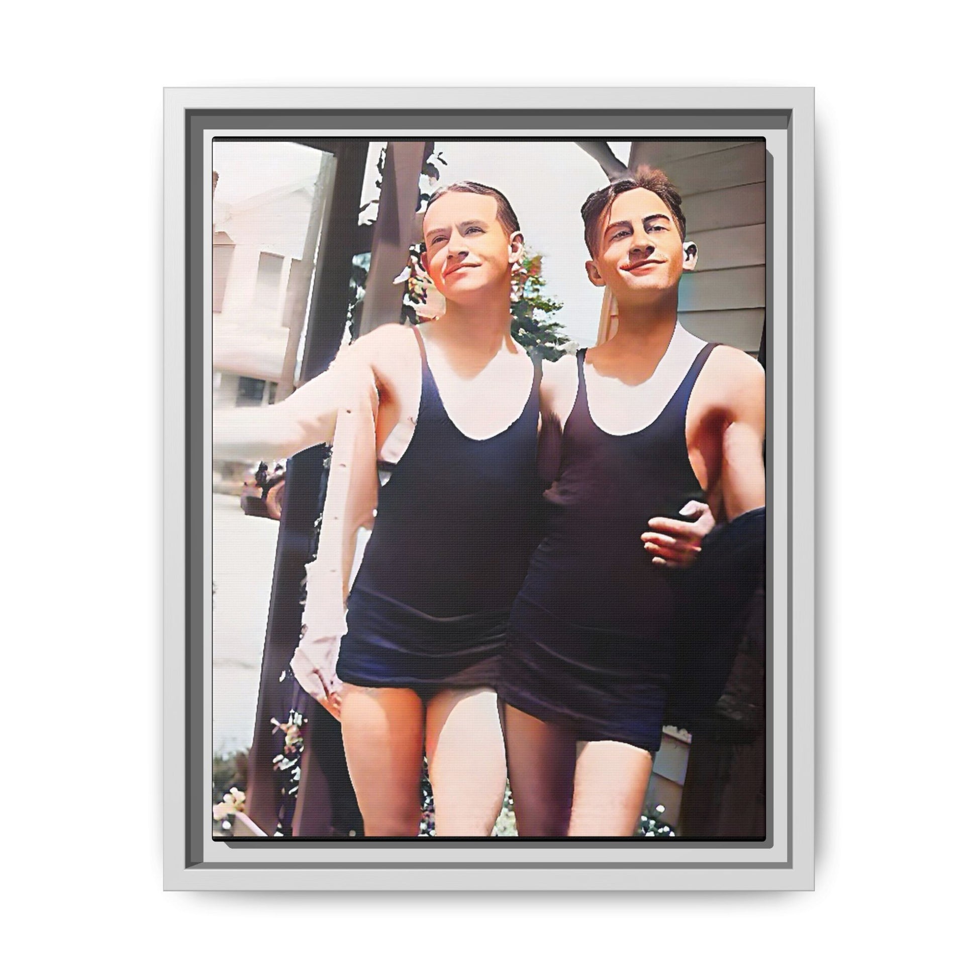 A beautifully restored vintage beach photo of two friends, Lee and Clifford, in classic black swimsuits, walking along Ocean Grove, New Jersey. Their smiles and relaxed body language capture the carefree joy of 1920s summer days, set against a charming coastal backdrop. Gay Couple