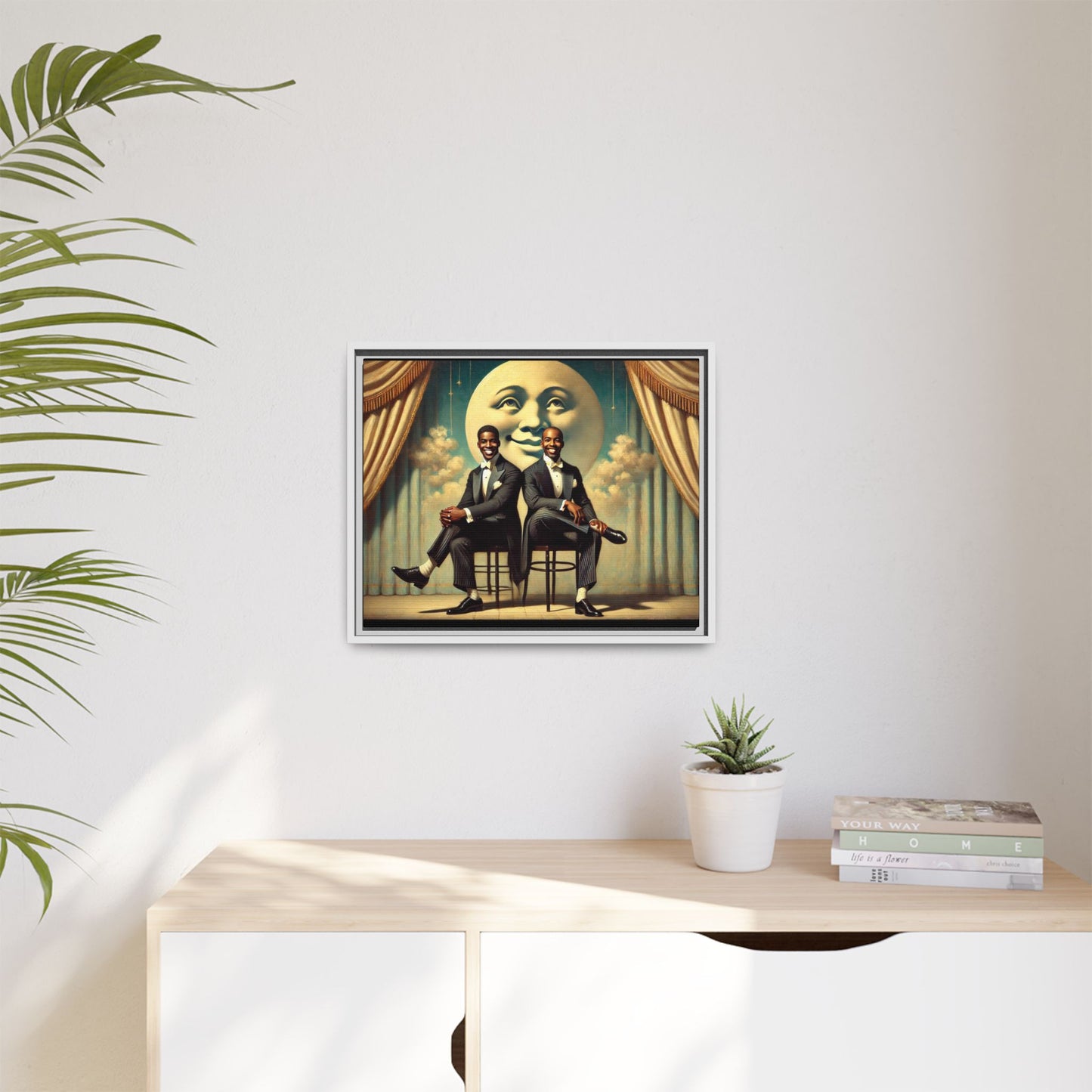 Framed vintage-style portrait of two Black men in tuxedos seated under a smiling crescent moon prop with golden curtains and cloud backdrop. This restored matte canvas honors lost LGBTQ history and reclaims early 20th-century queer representation with pride.