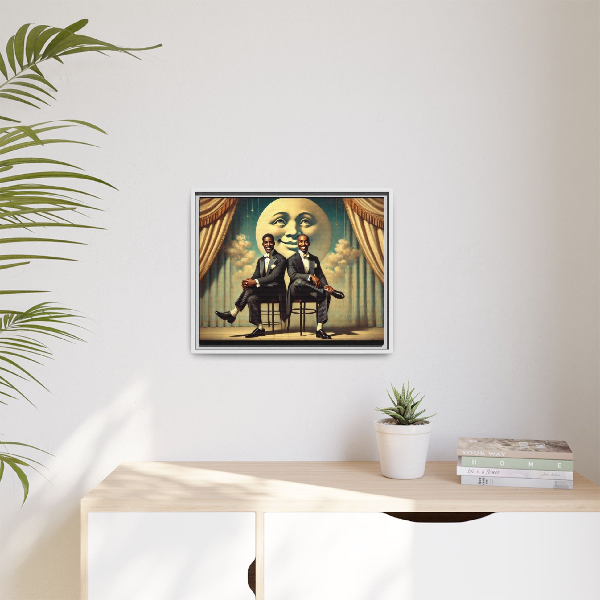 Framed vintage-style portrait of two Black men in tuxedos seated under a smiling crescent moon prop with golden curtains and cloud backdrop. This restored matte canvas honors lost LGBTQ history and reclaims early 20th-century queer representation with pride.