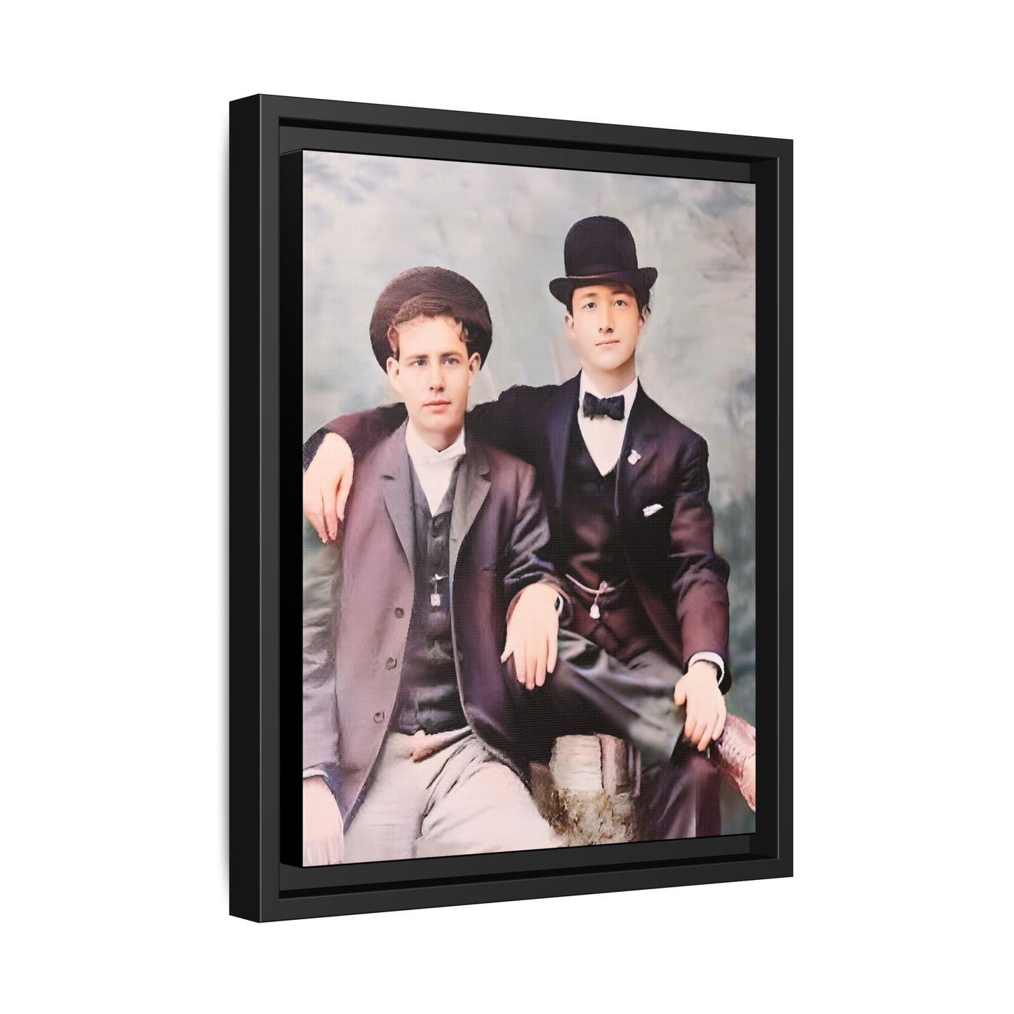 A stunningly restored early 20th-century portrait of Francis and Fai in Santa Barbara, California. Dressed in elegant bowler hats and classic suits, the two men share a poised yet deeply connected moment. The soft pastel tones and refined attire highlight a timeless love story, celebrating LGBTQ+ history and authentic companionship. Gay Couple