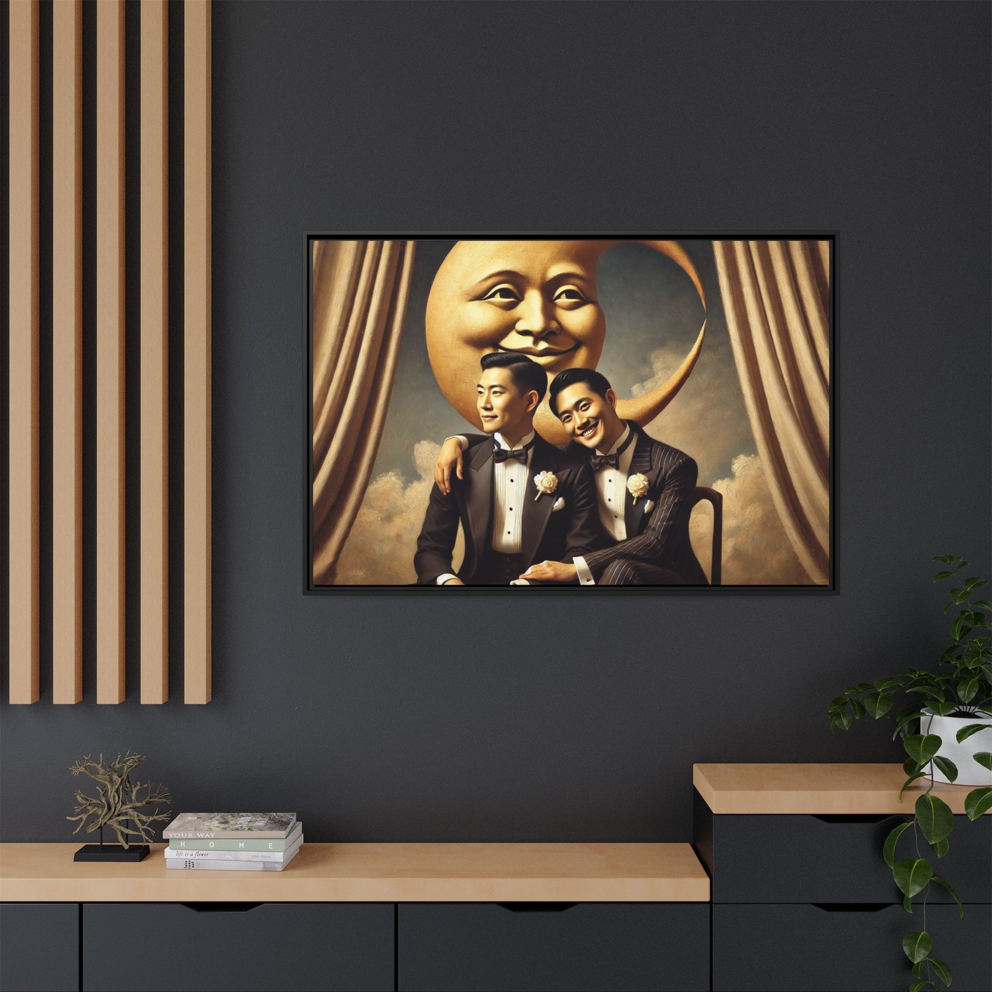Vintage-inspired artwork of a romantic gay Asian couple in tuxedos sitting affectionately beneath a smiling crescent moon prop, surrounded by vintage stage curtains and dreamy clouds. A reclaimed queer narrative from the Man In The Moon series.