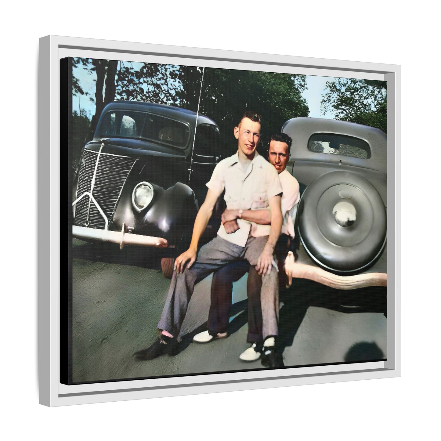 Restored vintage photograph of Andrew and Eugene seated on a classic car bumper in 1930s Lincoln, Nebraska. Framed matte canvas print celebrating LGBTQ+ history, love, and timeless companionship. Gay Couple