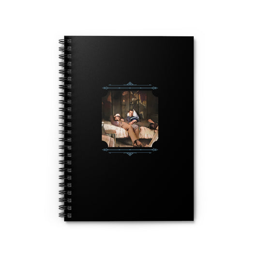 Spiral notebook featuring a restored vintage photo of two men lying together on a bed, full of quiet intimacy.