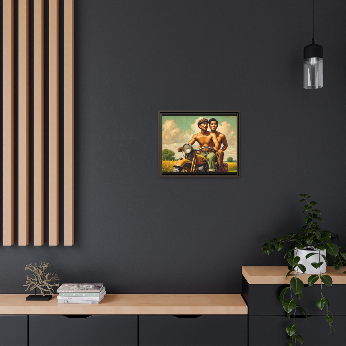 Framed artwork of an Asian-American gay couple riding a vintage yellow motorcycle through Iowa's serene countryside, celebrating love and unity.