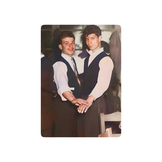 Vintage photo of a stylish gay couple in formal attire, clasping hands in a dance, symbolizing Queer love and joy.