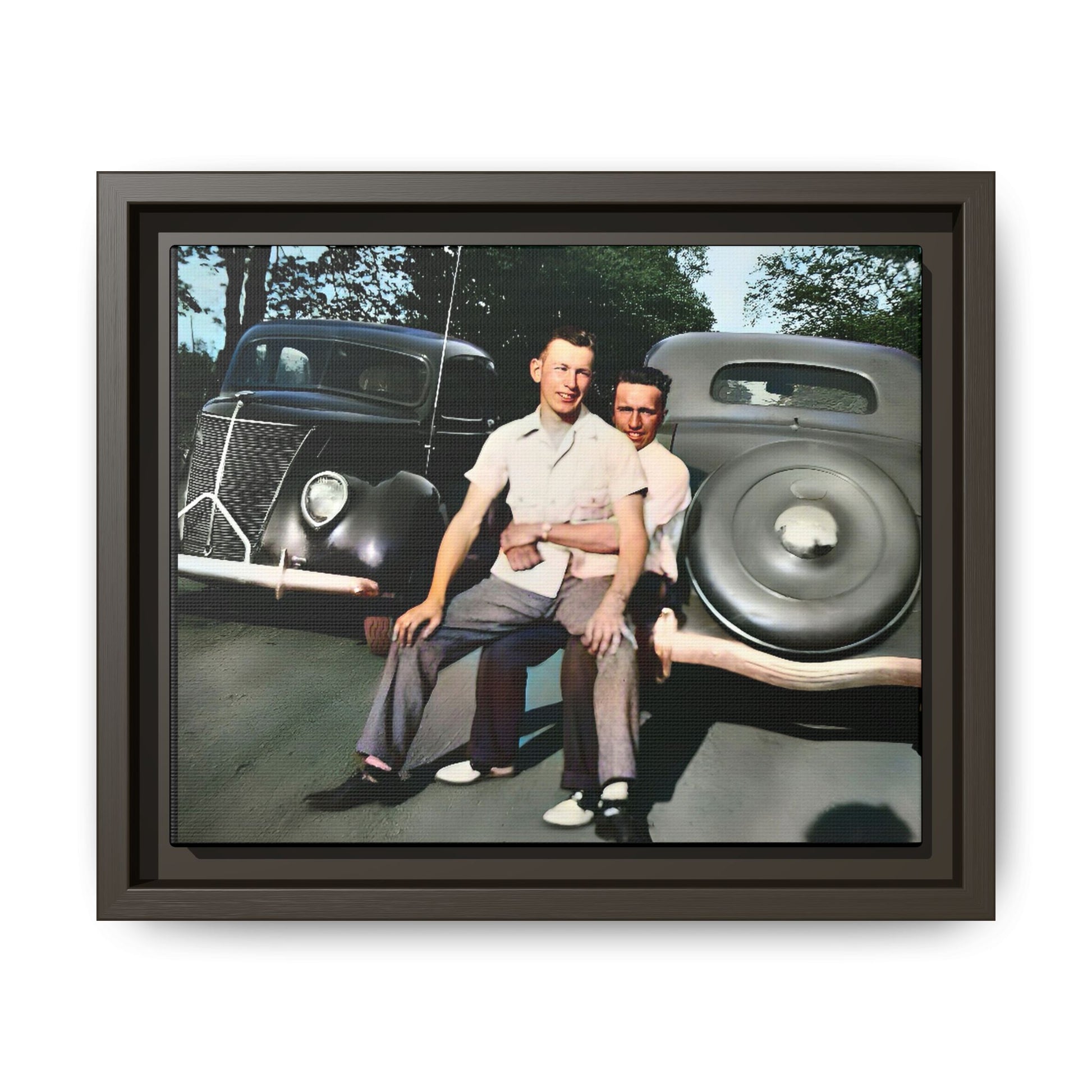 Restored vintage photograph of Andrew and Eugene seated on a classic car bumper in 1930s Lincoln, Nebraska. Framed matte canvas print celebrating LGBTQ+ history, love, and timeless companionship. Gay Couple