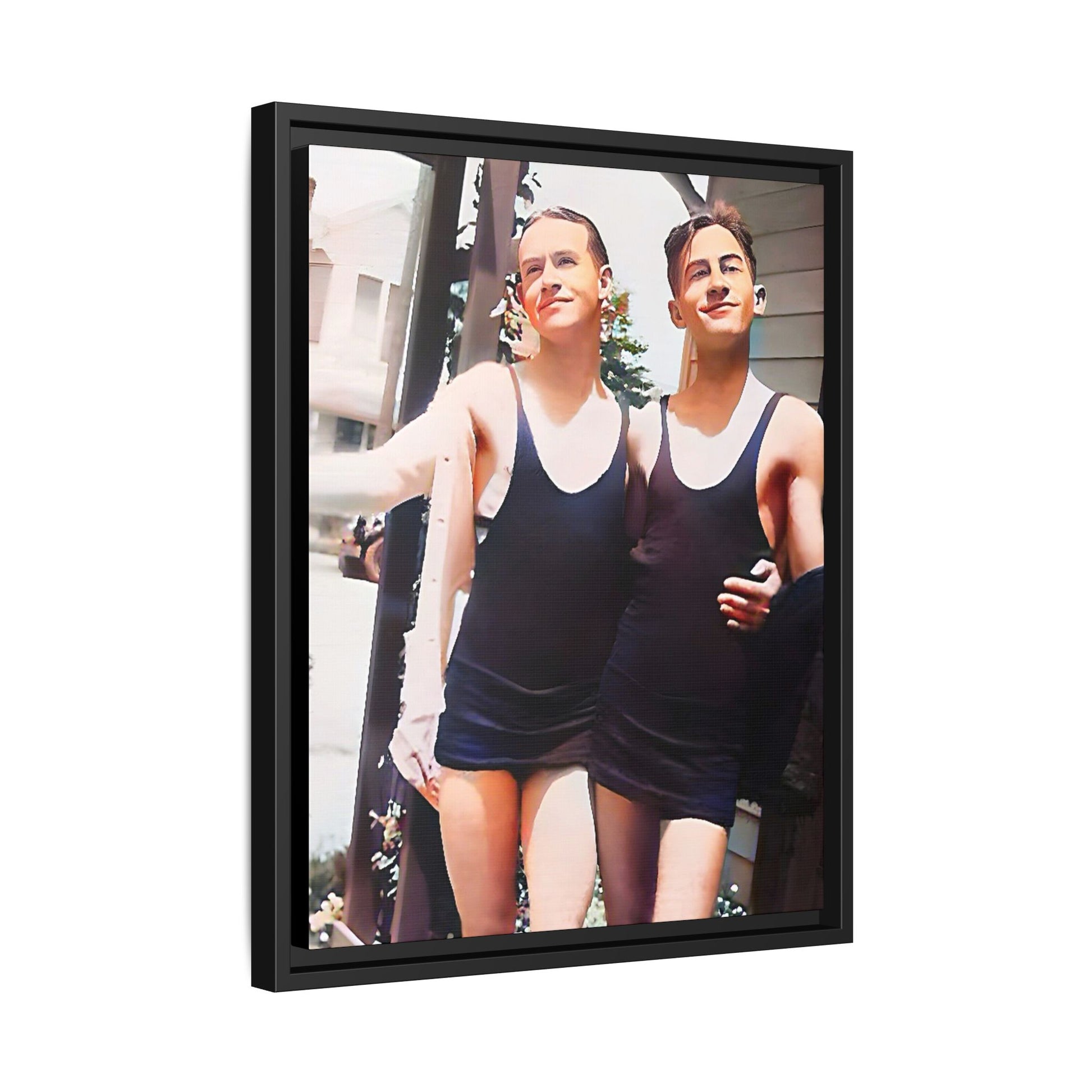 A beautifully restored vintage beach photo of two friends, Lee and Clifford, in classic black swimsuits, walking along Ocean Grove, New Jersey. Their smiles and relaxed body language capture the carefree joy of 1920s summer days, set against a charming coastal backdrop. Gay Couple