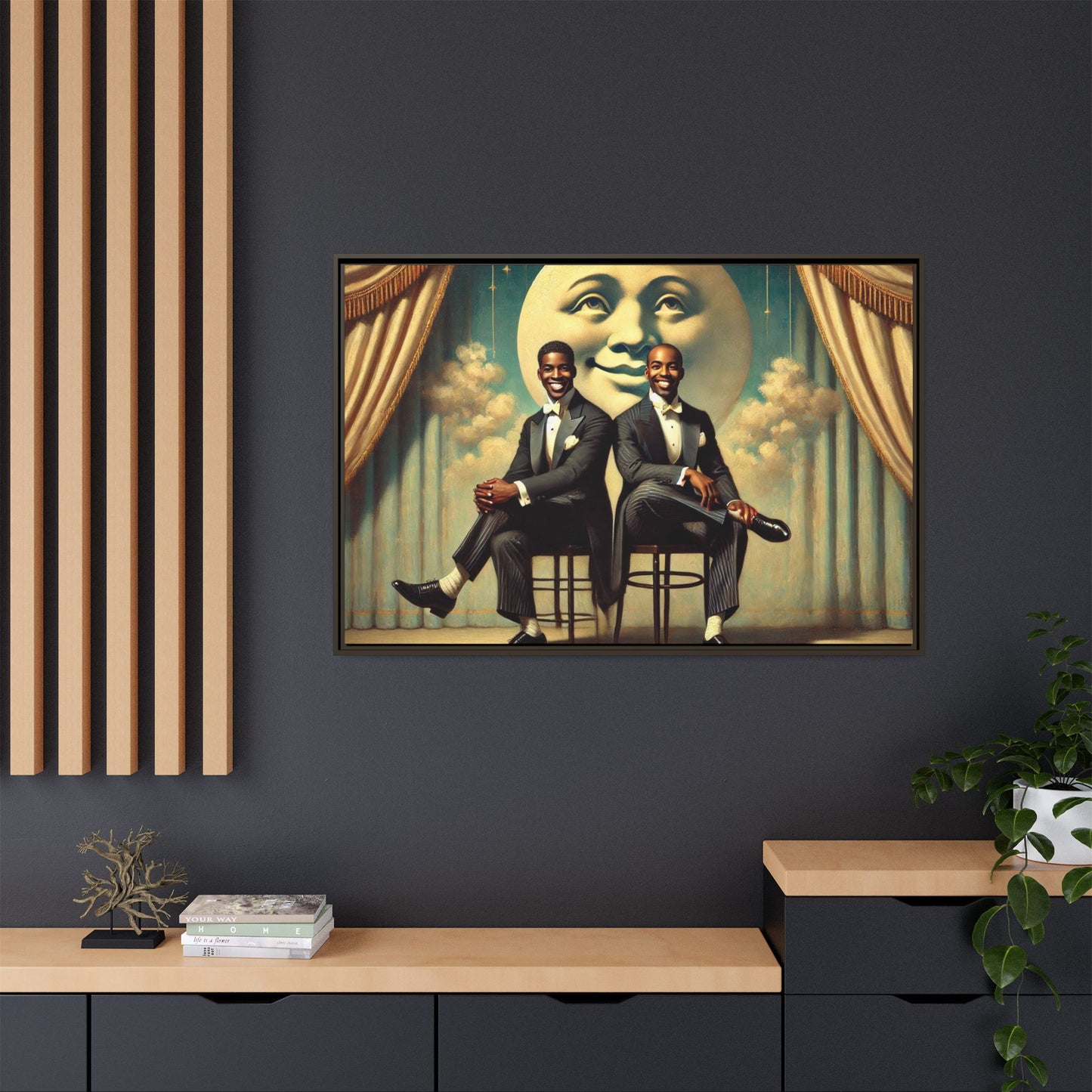 Framed vintage-style portrait of two Black men in tuxedos seated under a smiling crescent moon prop with golden curtains and cloud backdrop. This restored matte canvas honors lost LGBTQ history and reclaims early 20th-century queer representation with pride.