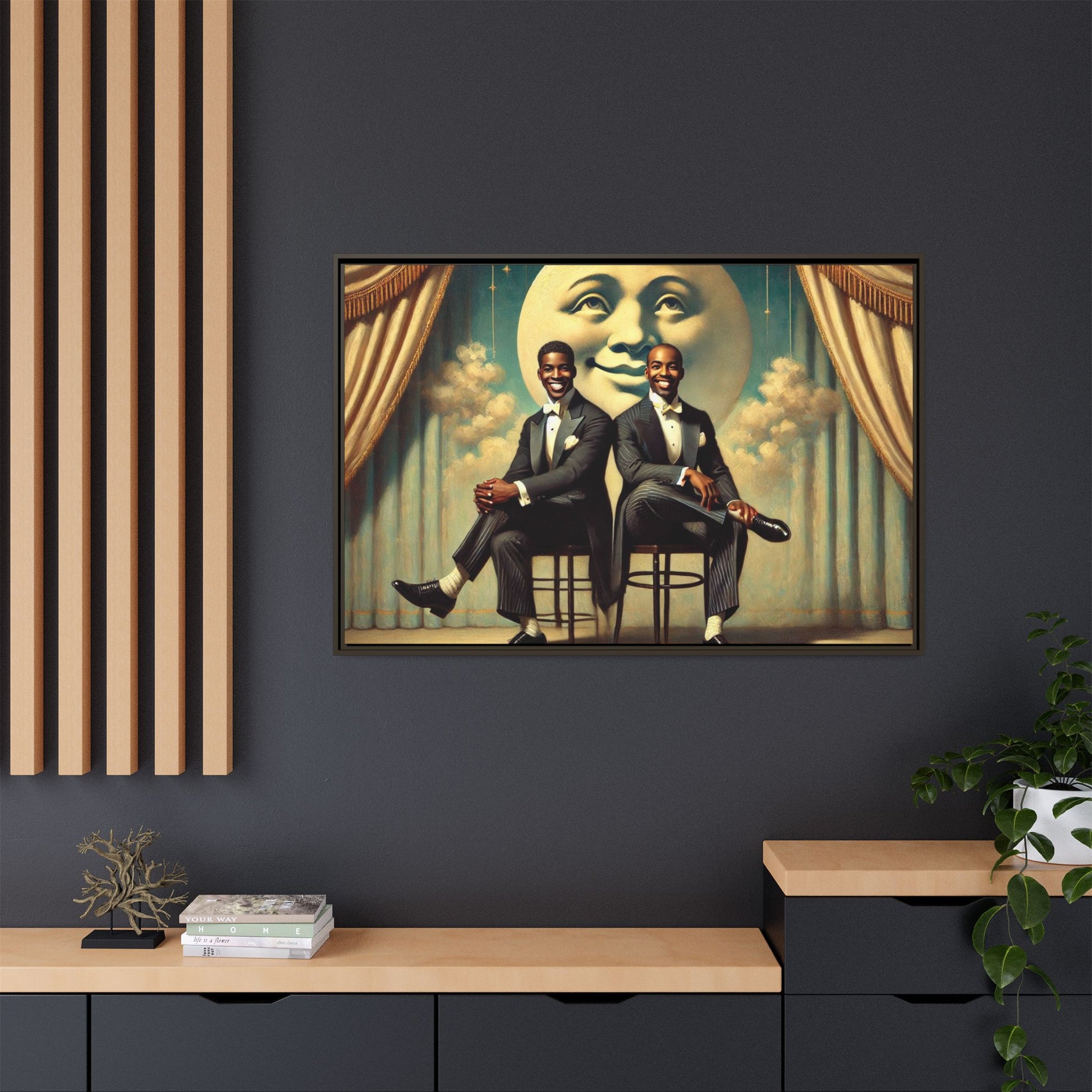 Framed vintage-style portrait of two Black men in tuxedos seated under a smiling crescent moon prop with golden curtains and cloud backdrop. This restored matte canvas honors lost LGBTQ history and reclaims early 20th-century queer representation with pride.