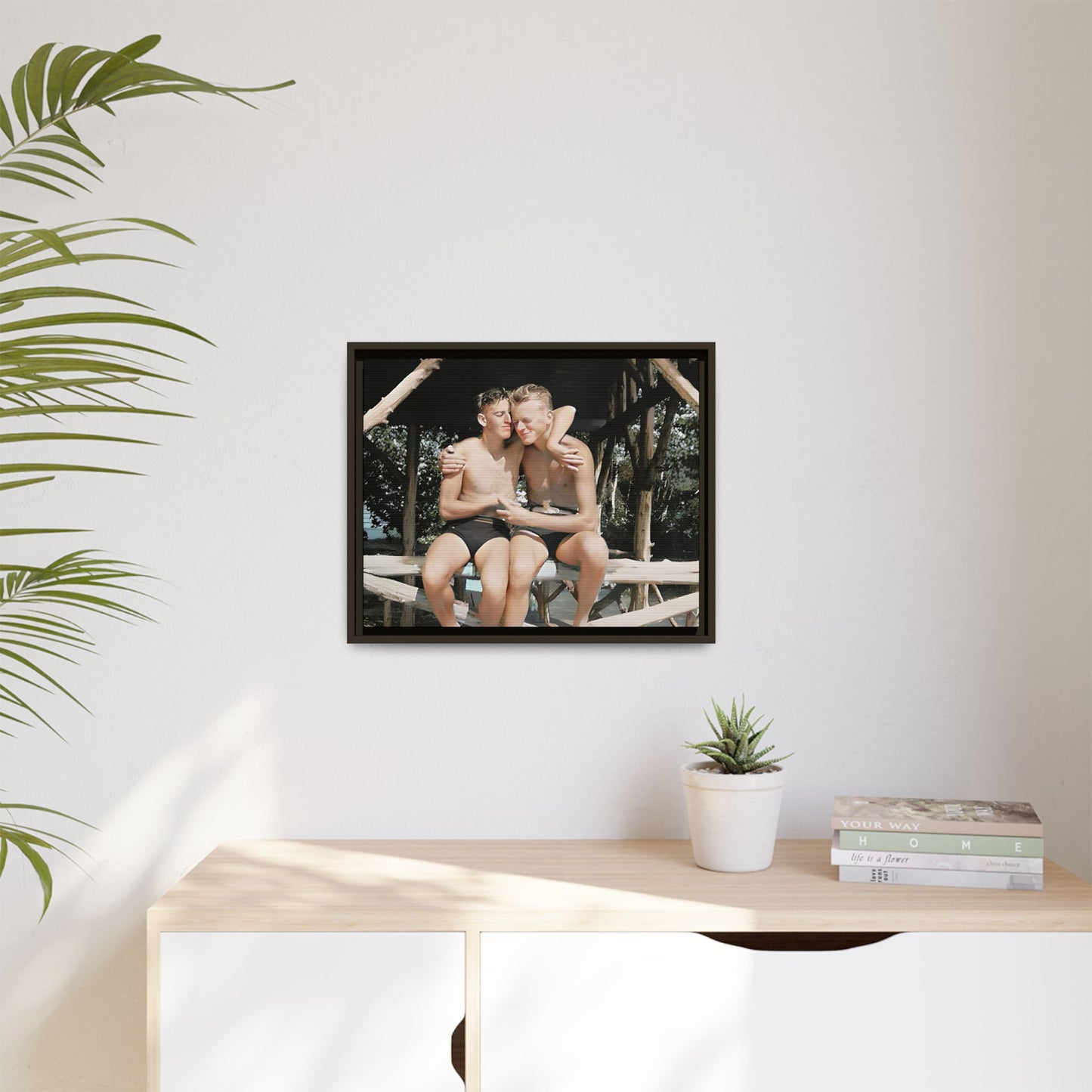 A vintage-inspired framed canvas print featuring Joseph and Billy at Kahena Beach, Hawaii. Their intimate moment under a sunlit pergola captures the warmth of love, freedom, and tropical serenity—perfect for coastal, LGBTQ+, and romantic home decor.