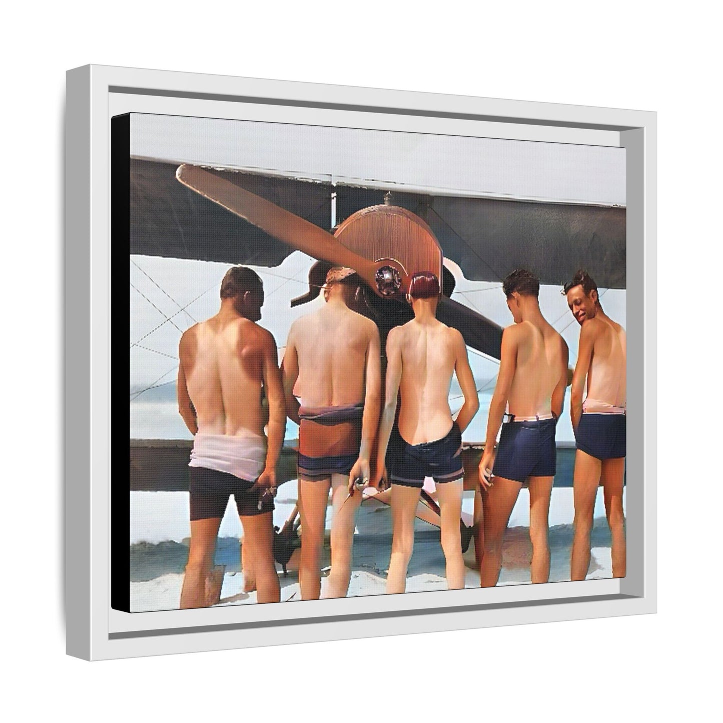 A beautifully restored vintage photograph of five men standing on a sunlit Key West beach with a vintage aircraft in the background. This nostalgic canvas print captures coastal adventure, camaraderie, and the free spirit of aviation history. Men urinating