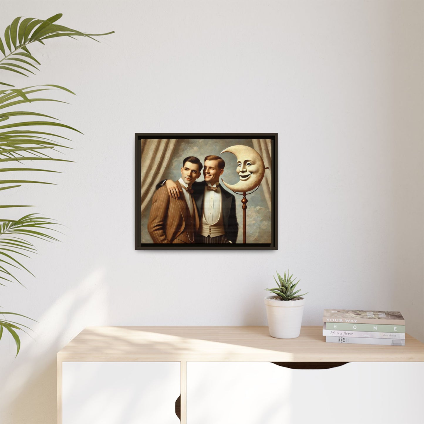 Framed matte canvas artwork of two men in vintage tuxedos standing beside a crescent moon prop. This piece reclaims LGBTQ+ representation lost to bias and honors everyday moments of affection and connection once absent from historical archives.