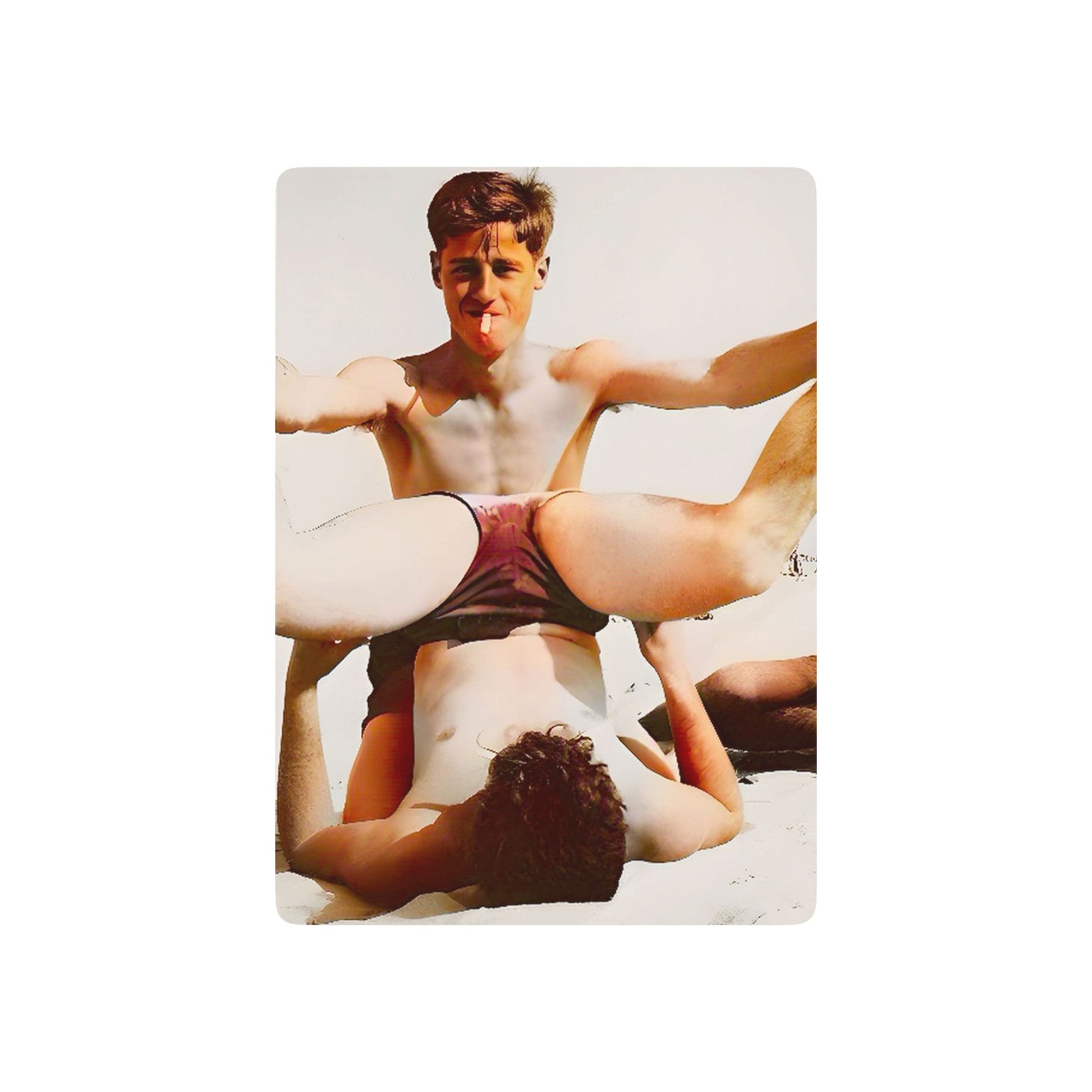 Vintage poker cards featuring a restored beach photo of two young men in playful camaraderie, honoring LGBTQ+ history.