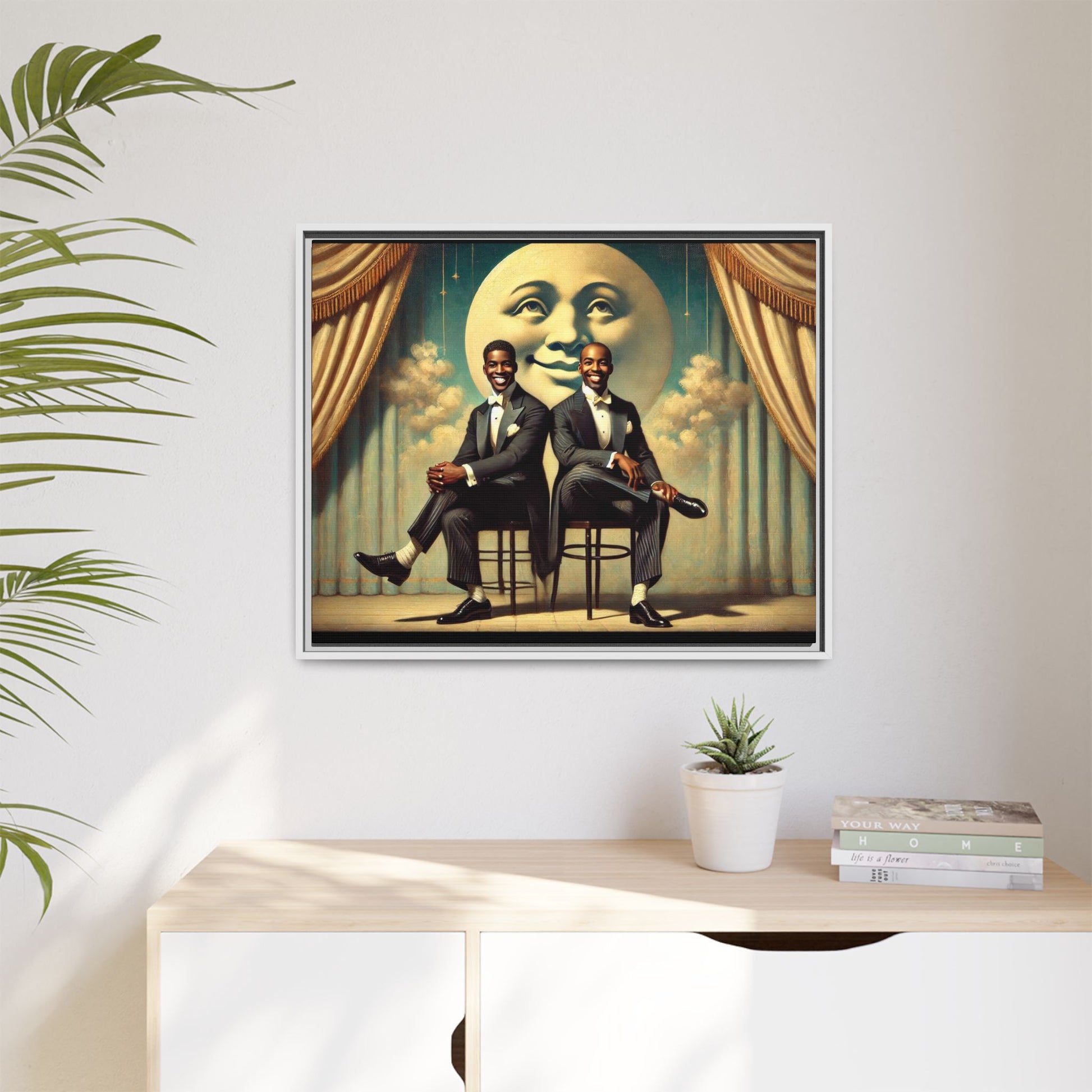Framed vintage-style portrait of two Black men in tuxedos seated under a smiling crescent moon prop with golden curtains and cloud backdrop. This restored matte canvas honors lost LGBTQ history and reclaims early 20th-century queer representation with pride.