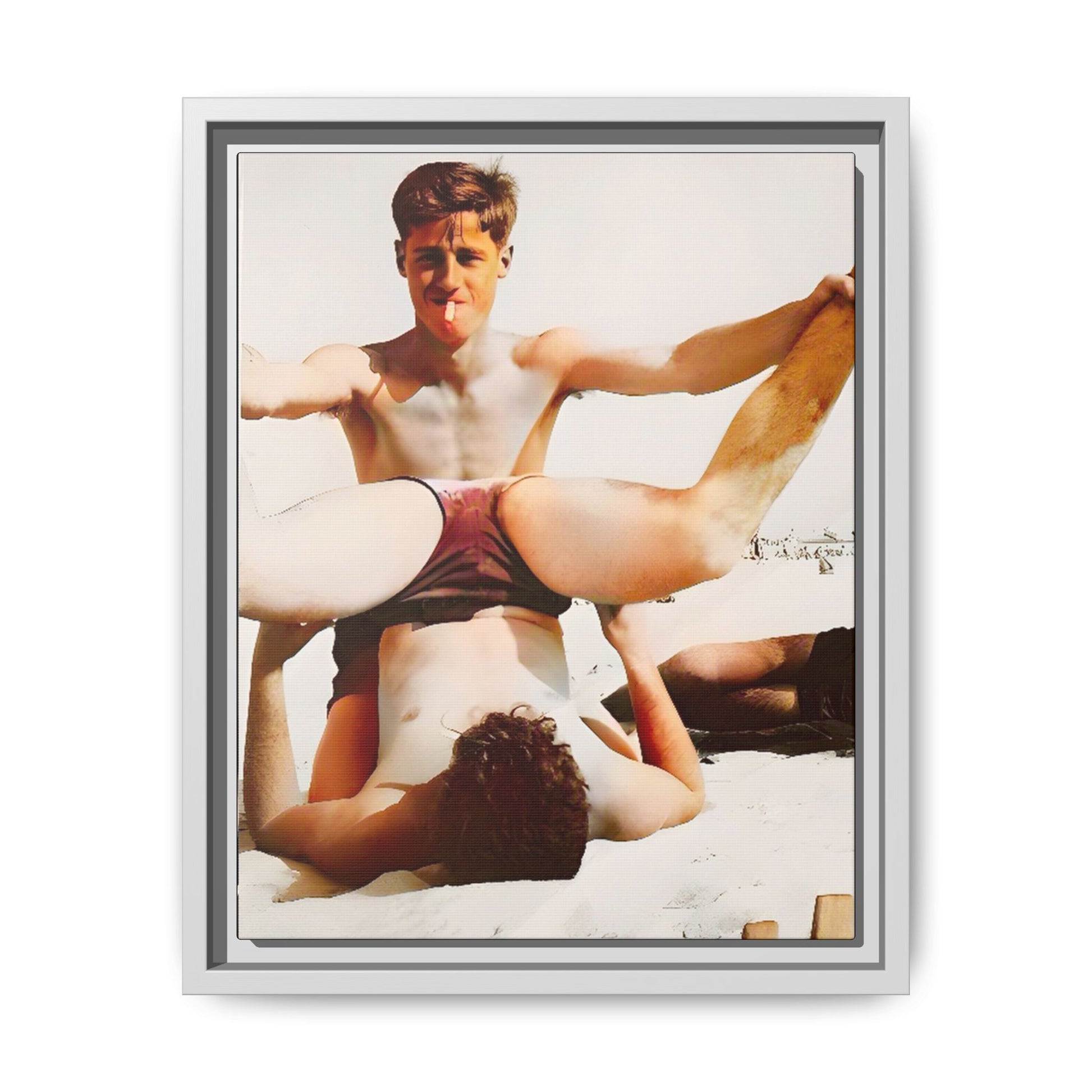 Restored mid-20th century photo of Mitch and Sam at 12th Street Beach, Miami, sharing a playful moment of love and joy, framed as wall décor.
