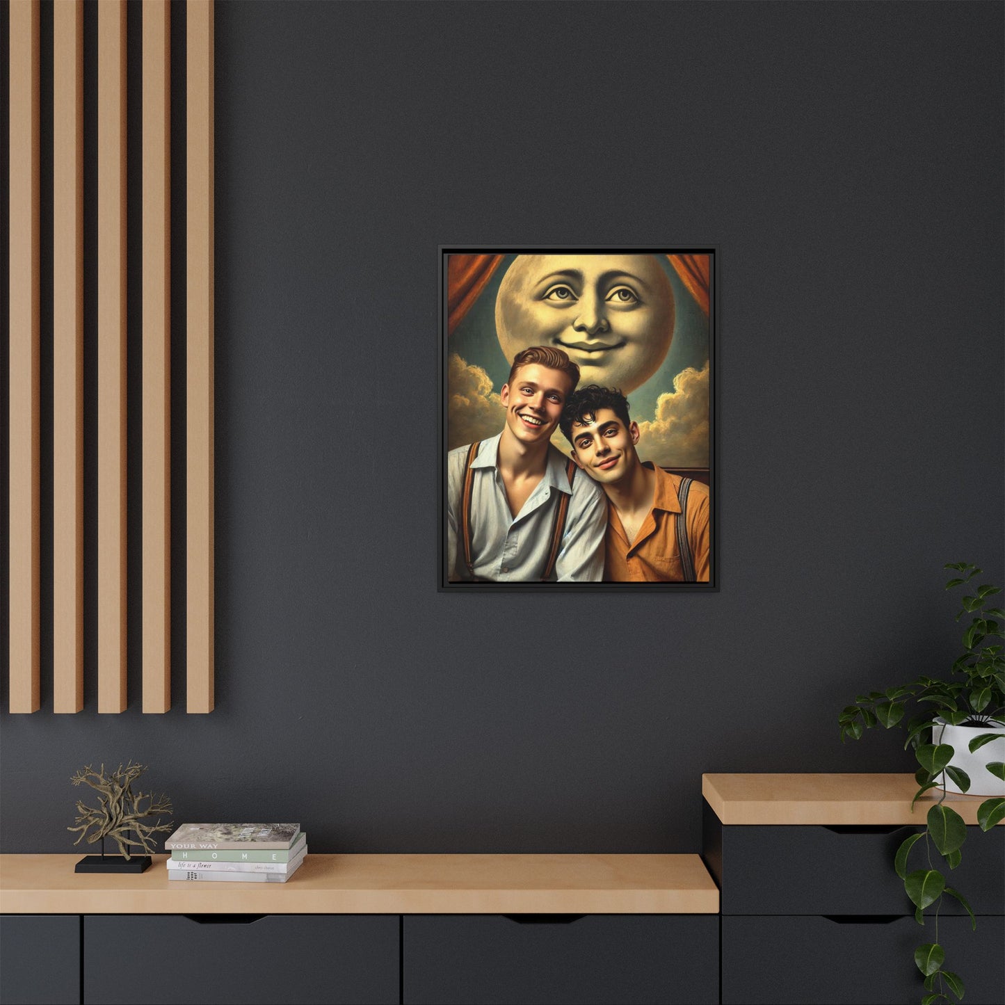 Framed artwork featuring a joyful queer couple in 1930s attire, seated close together beneath a smiling full moon in a theatrical studio setting. A celebration of reclaimed LGBTQ+ narratives in nostalgic portraiture.
