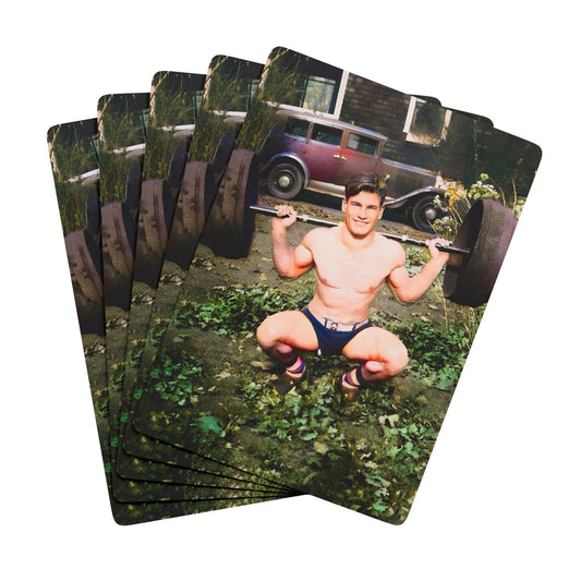 Vintage photo of a shirtless weightlifter balancing a barbell, showcasing early fitness culture and Queer resilience.