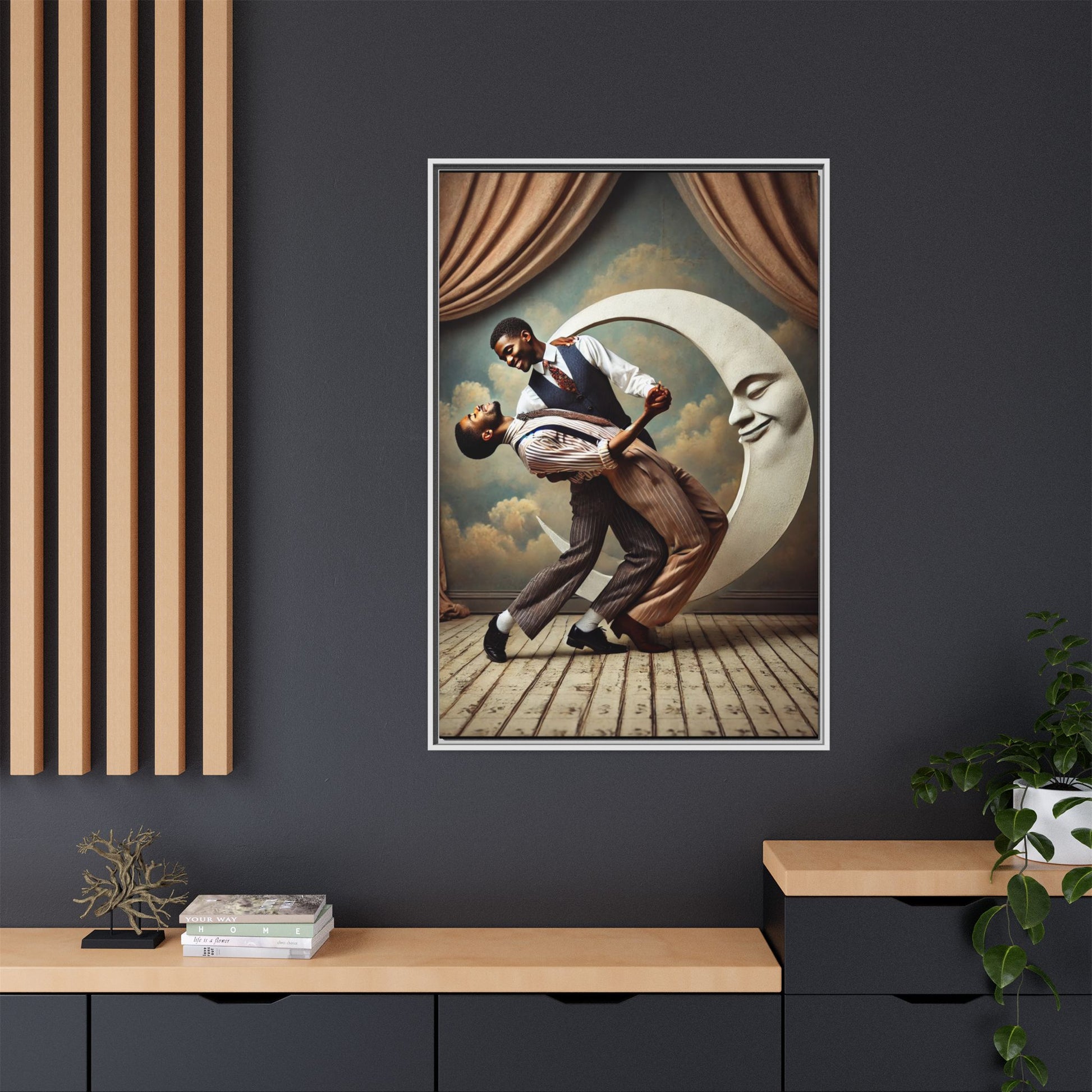 Framed artwork of two Black men in vintage suits dancing tenderly beneath a crescent moon with a smiling face. A romantic 1920s-inspired scene with velvet curtains and a painted sky backdrop. Part of a collection reclaiming lost queer Black history and art.