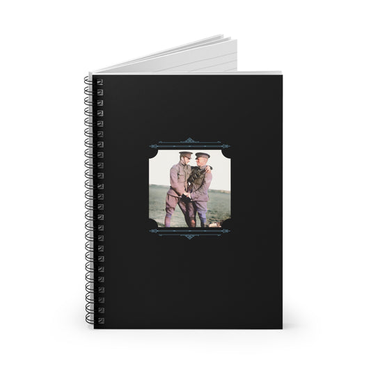 Colorized early 20th-century image of gay couple in military uniform embracing outdoors on a black spiral notebook cover
