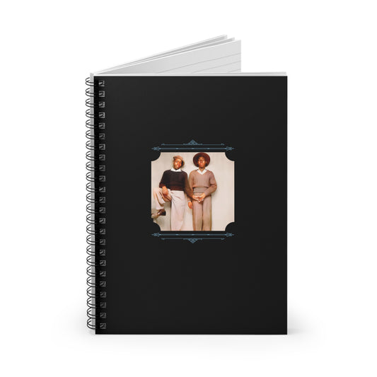 Black spiral notebook with a vintage colorized image of a fashionable Black gay couple from the early 20th century