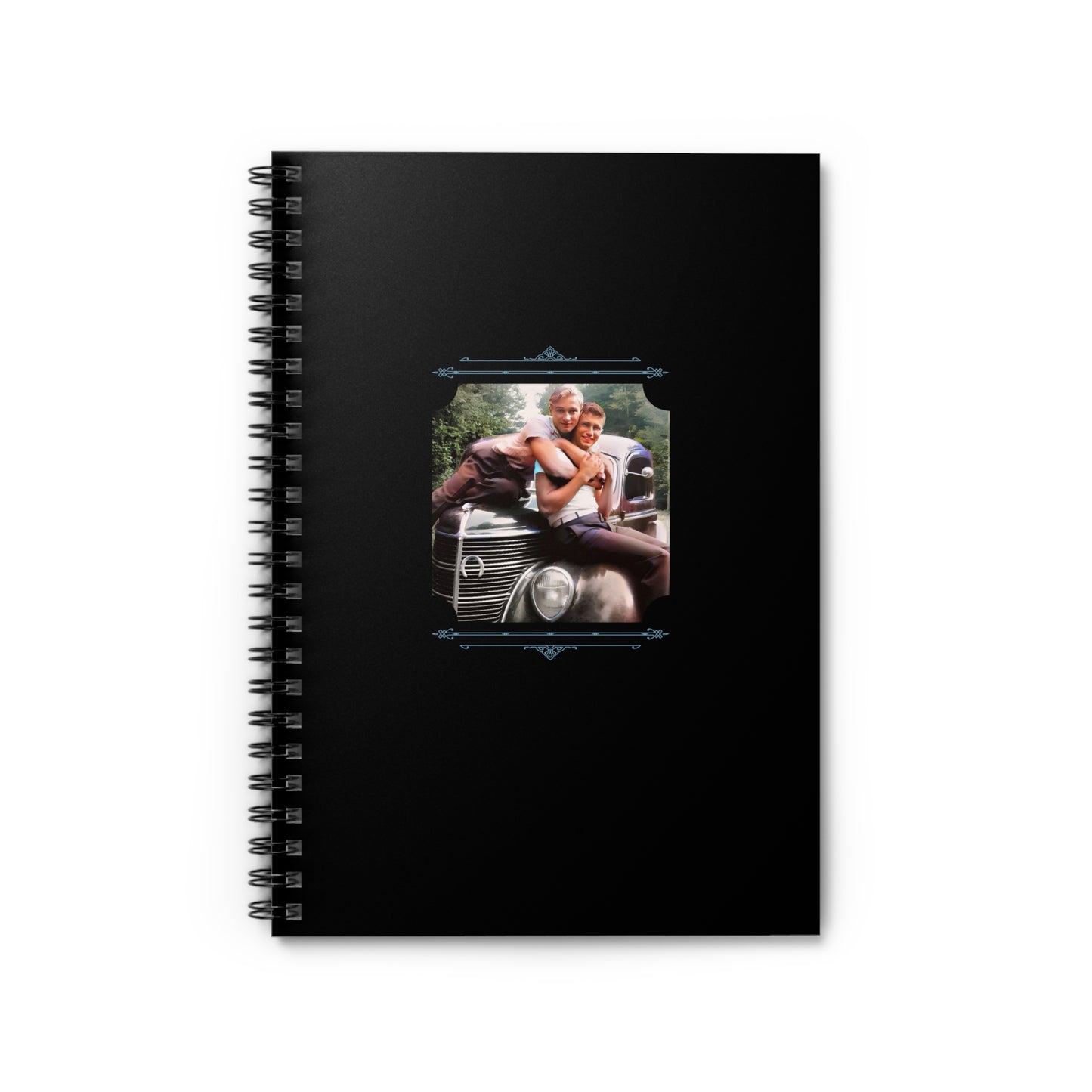 Spiral notebook featuring a vintage photo of two men affectionately sitting on a classic car hood in the 1940s.